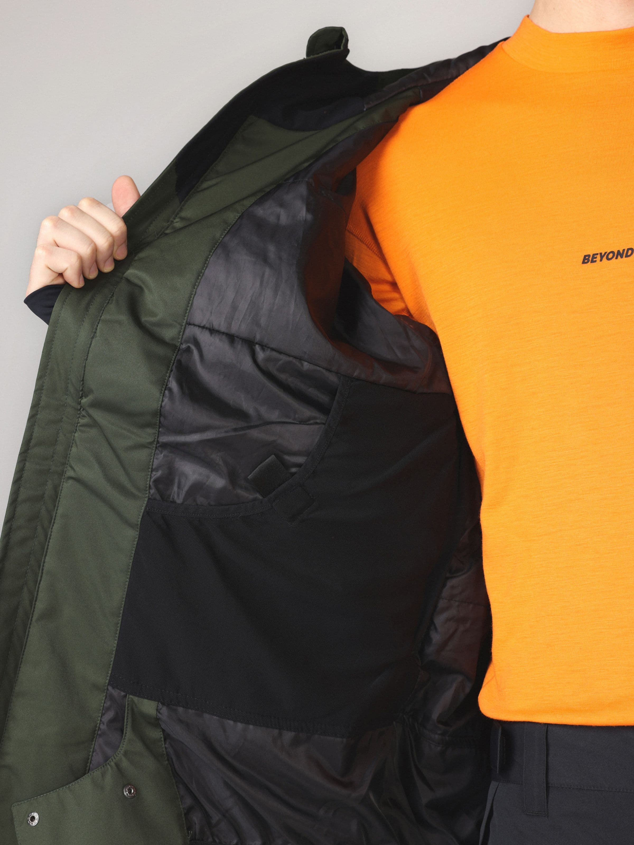 Outwear apparel, Full Zip Jkt in green worn by model, Beyond Medals, 2024