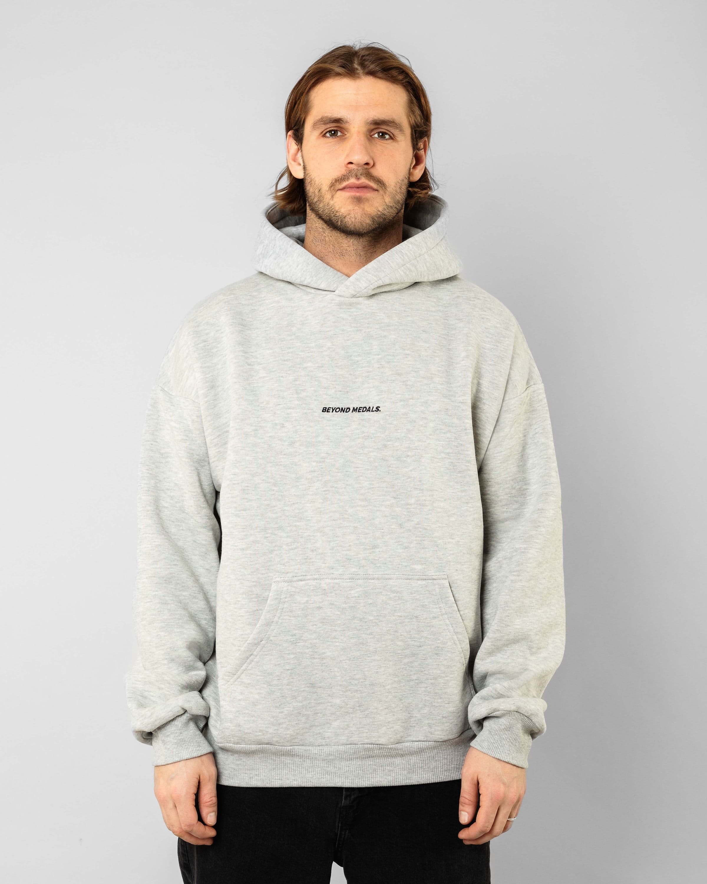 Comfortable streetwear clothing, Angel Hoodie in gray worn by model, Beyond Medals, 2023