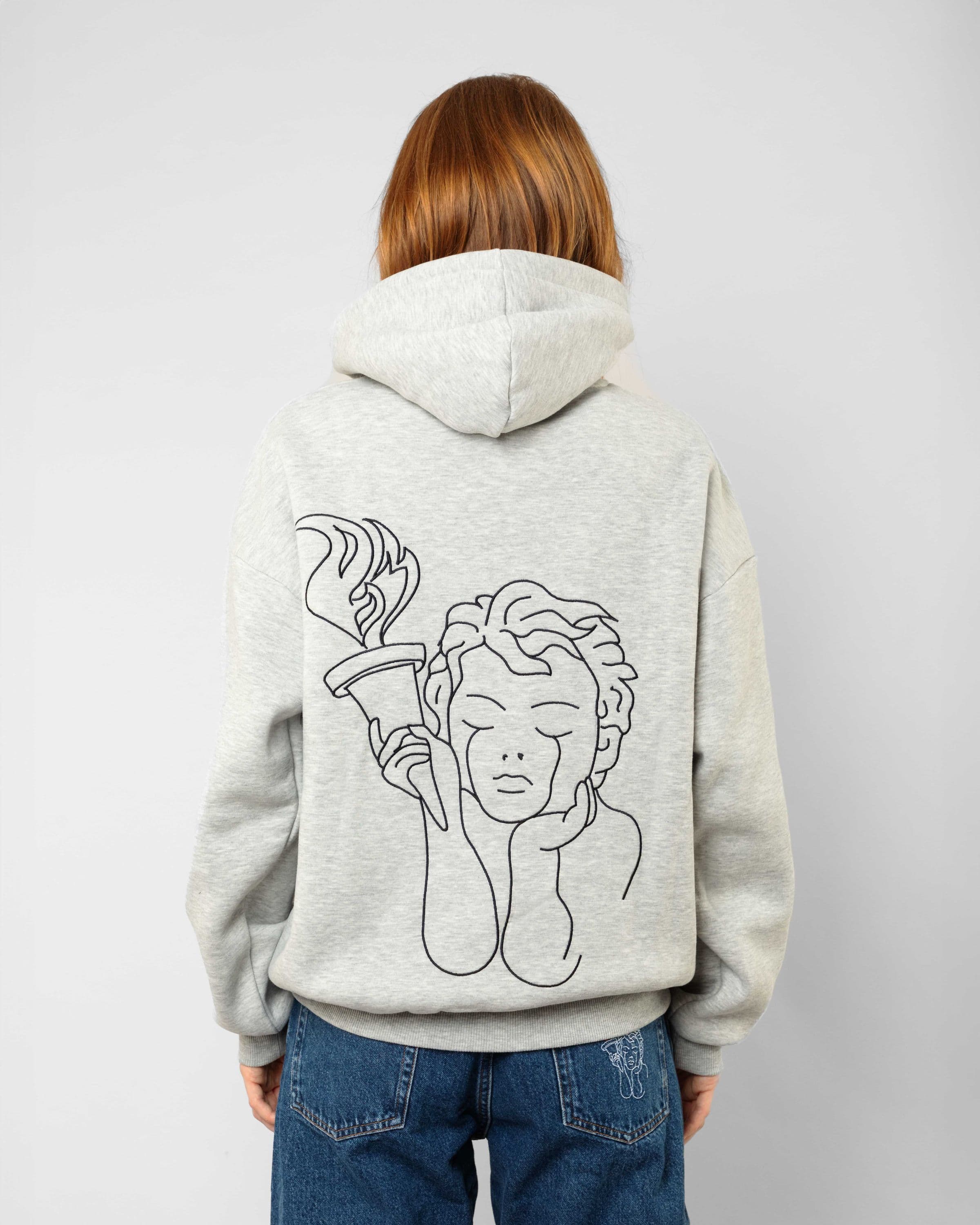 Comfortable streetwear clothing, Angel Hoodie in gray worn by model, Beyond Medals, 2023