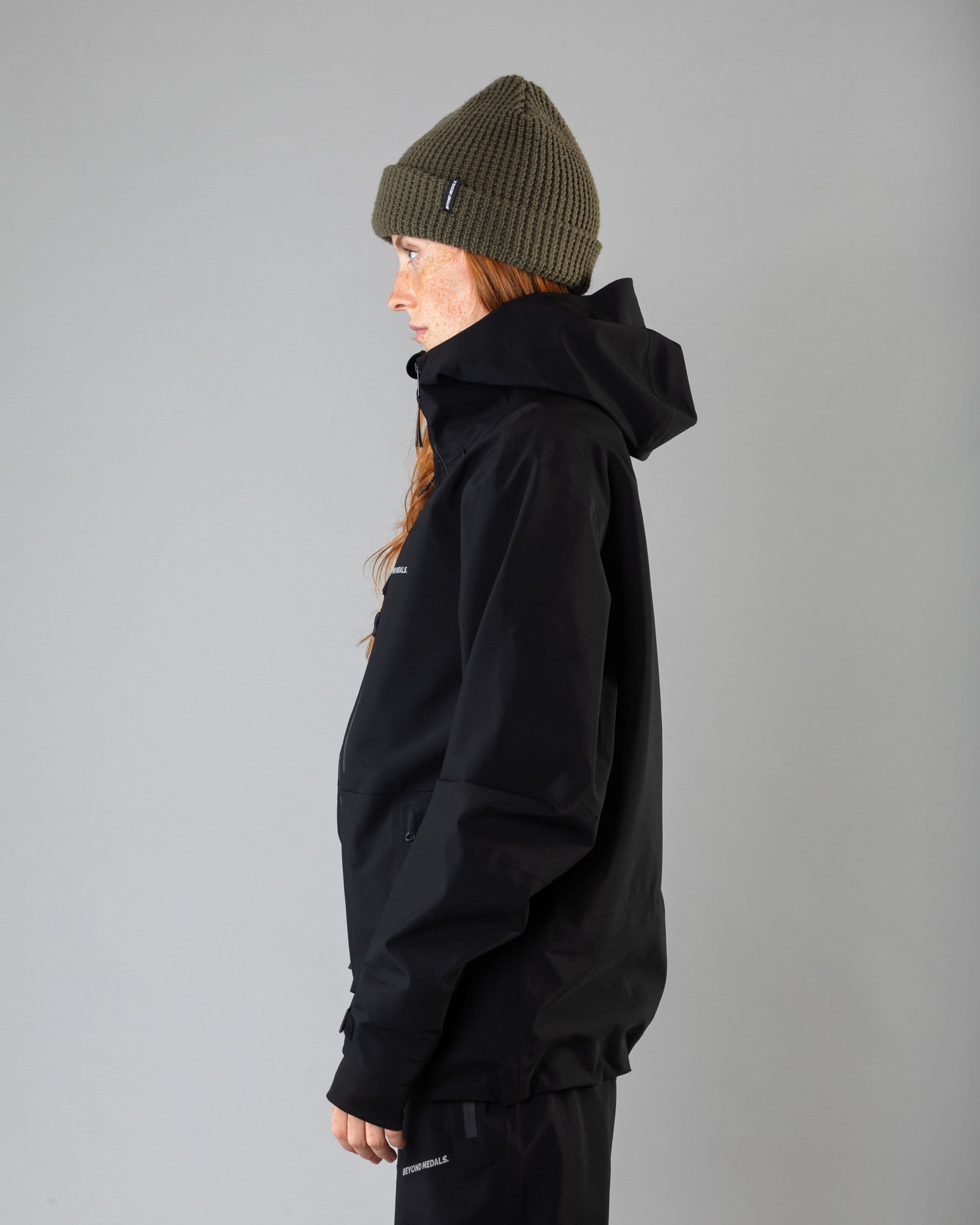 Outerwear clothing, pro tech jacket 3l in black worn by model, Beyond Medals, 2024, side