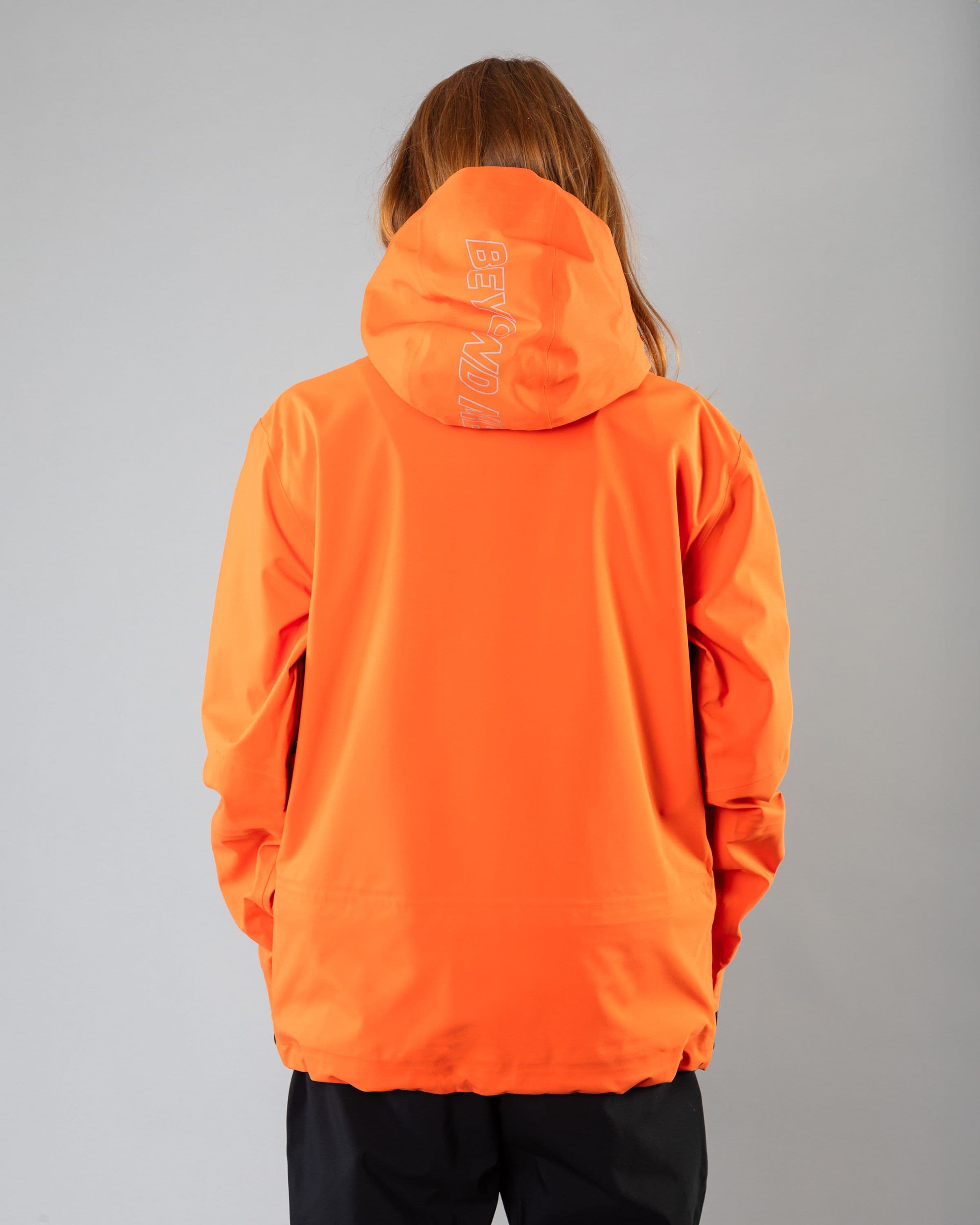 Outerwear clothing, pro tech jacket 3l in orange worn by model, Beyond Medals, 2024, back