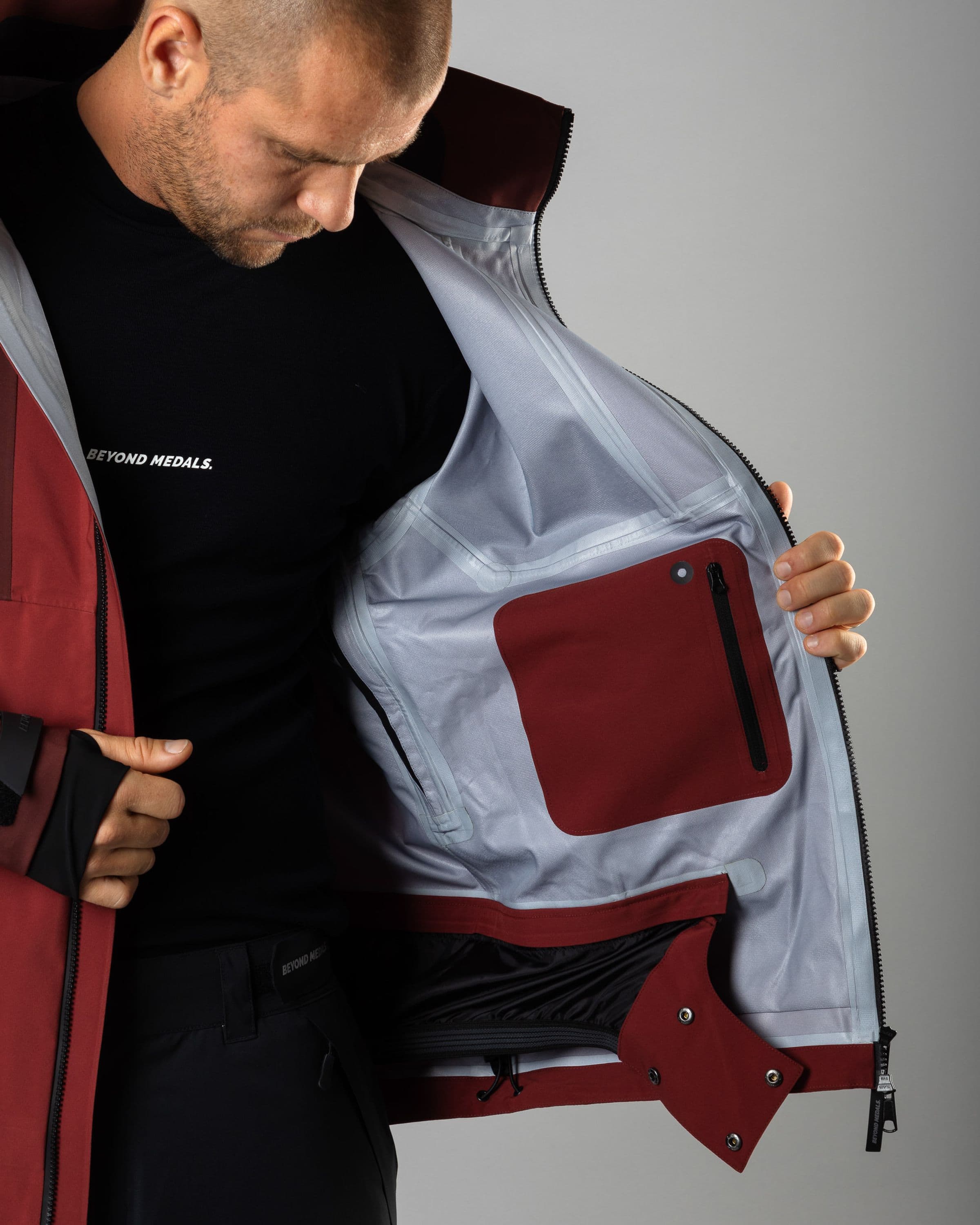 Outerwear clothing, tech jacket 3l in red worn by TOR LUNDSTRÖM, Beyond Medals, 2024, detail6