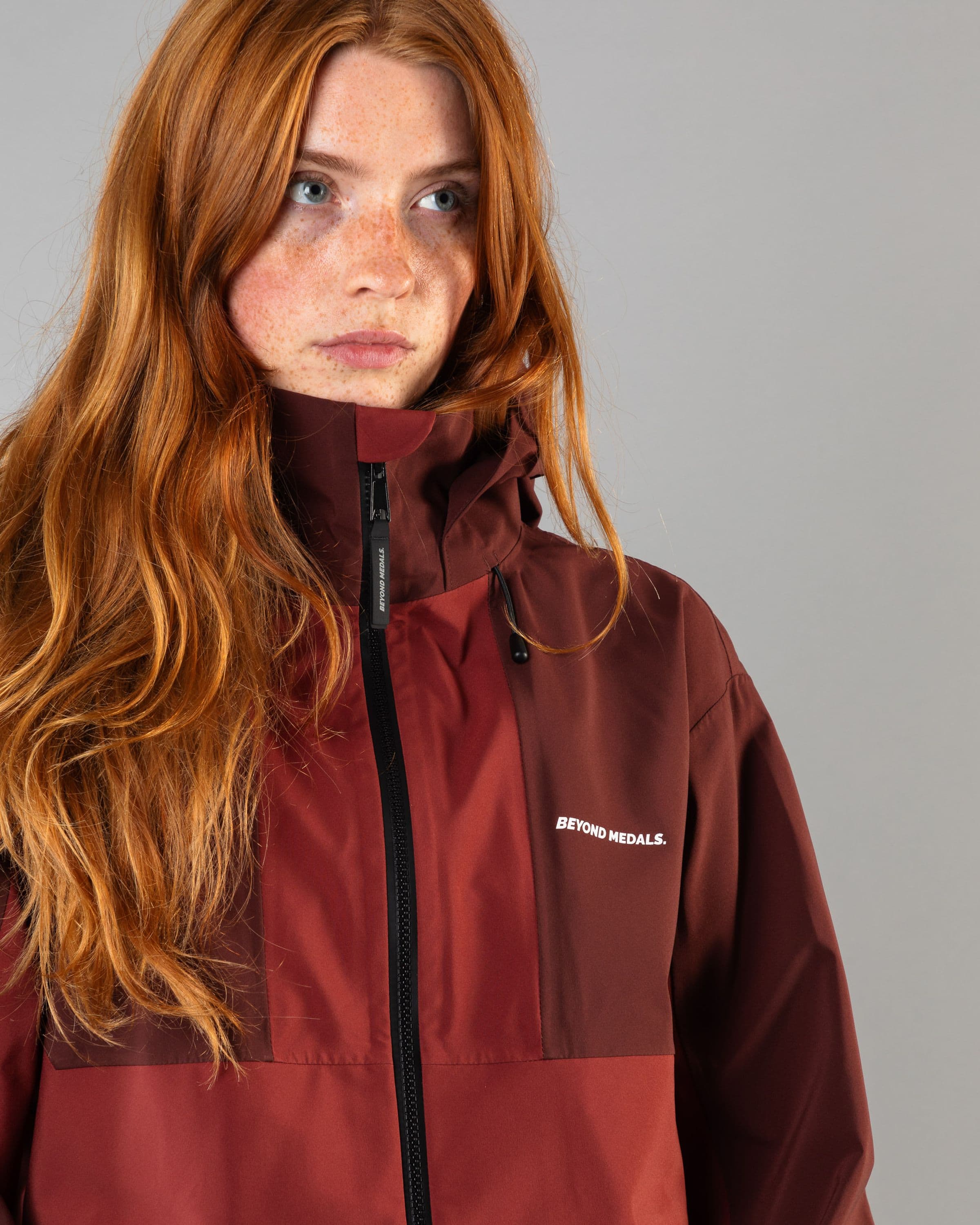 Outerwear clothing, tech jacket 3l in red worn by model, Beyond Medals, 2024, detail1