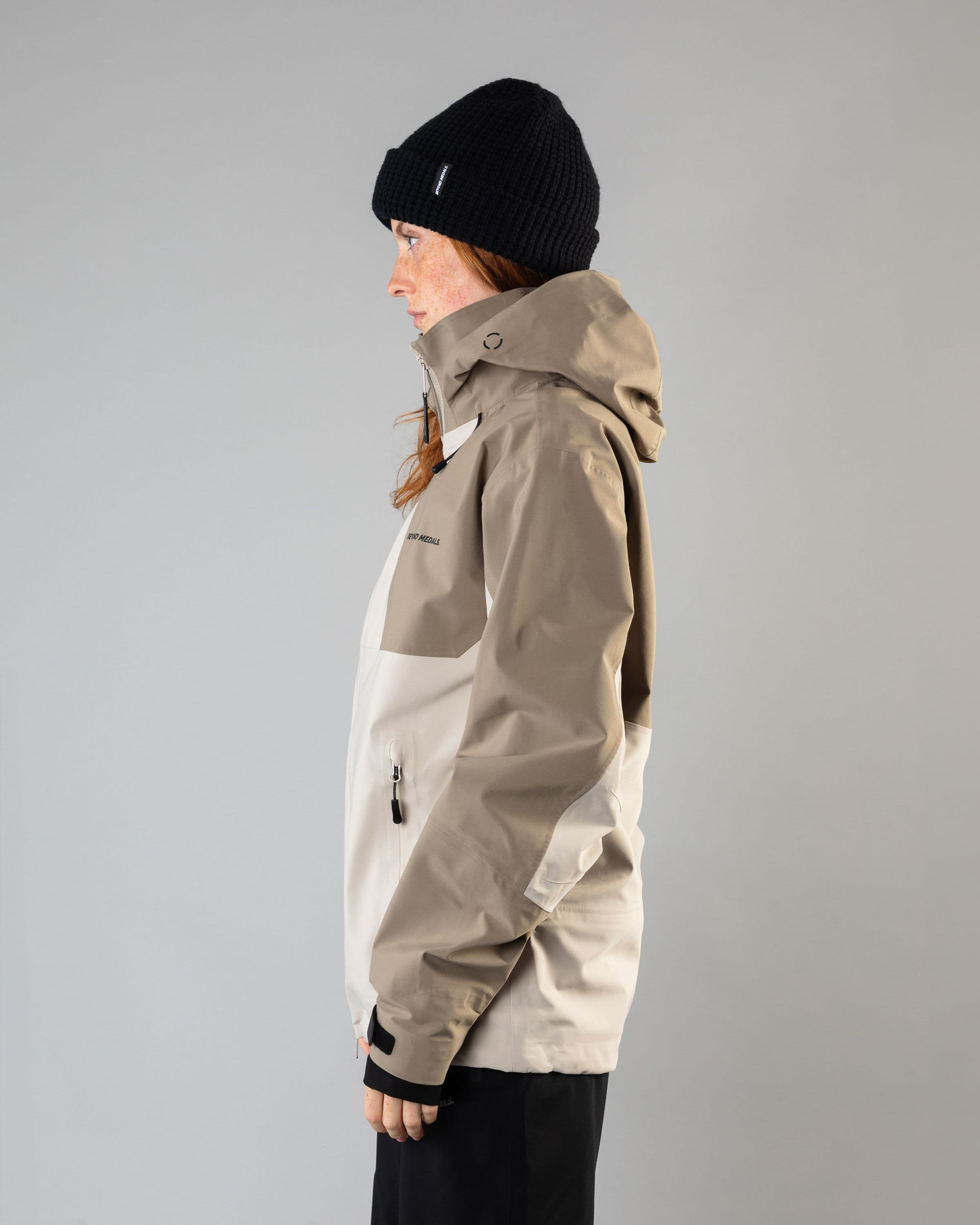 Outerwear clothing, tech jacket 3l in lt.beige worn by model, Beyond Medals, 2024, side