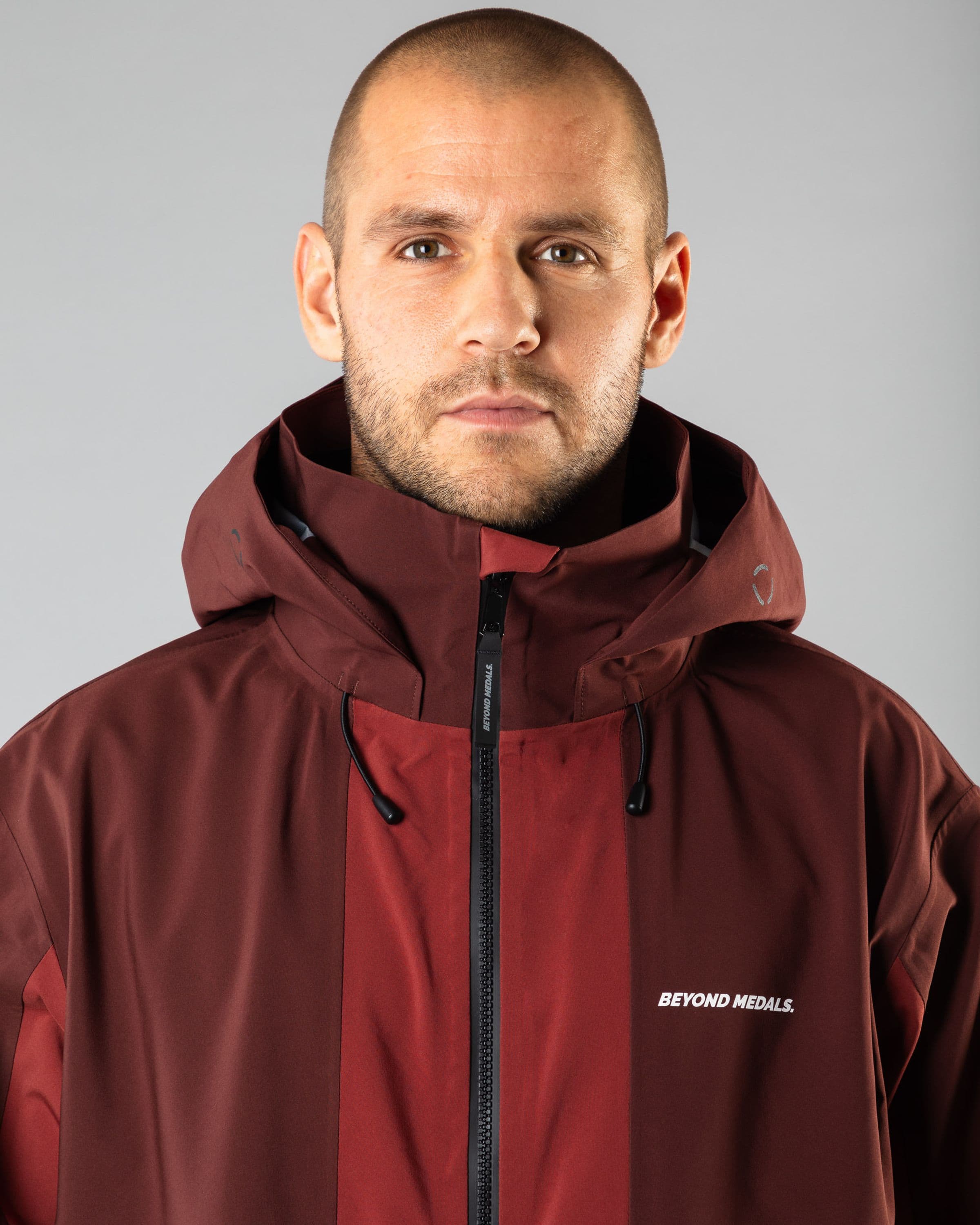 Outerwear clothing, tech jacket 3l in red worn by TOR LUNDSTRÖM, Beyond Medals, 2024, detail2