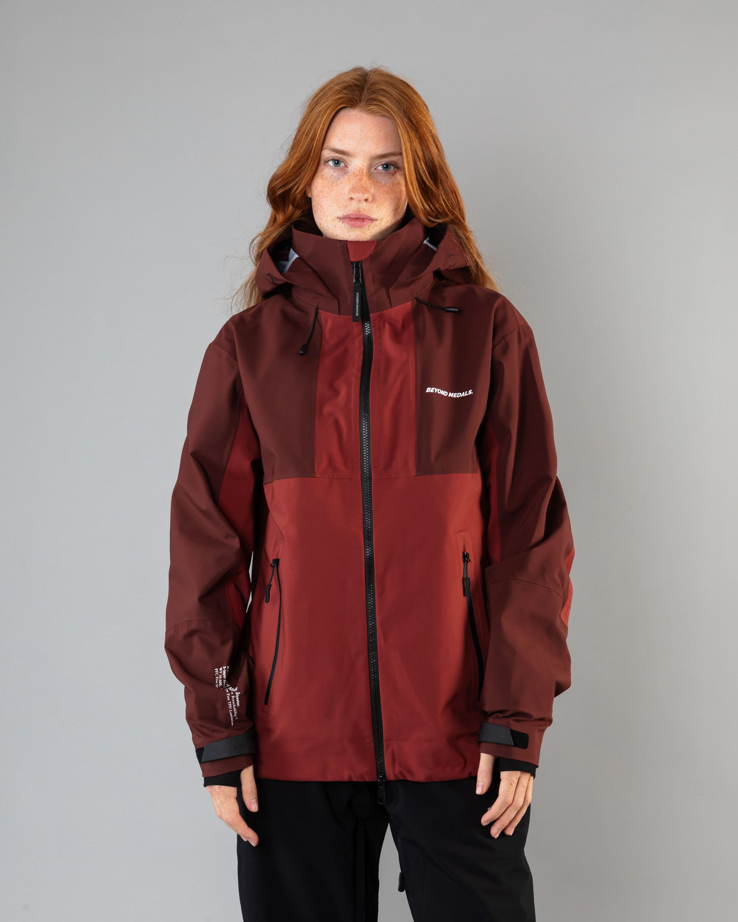 Outerwear clothing, tech jacket 3l in red worn by model, Beyond Medals, 2024, front
