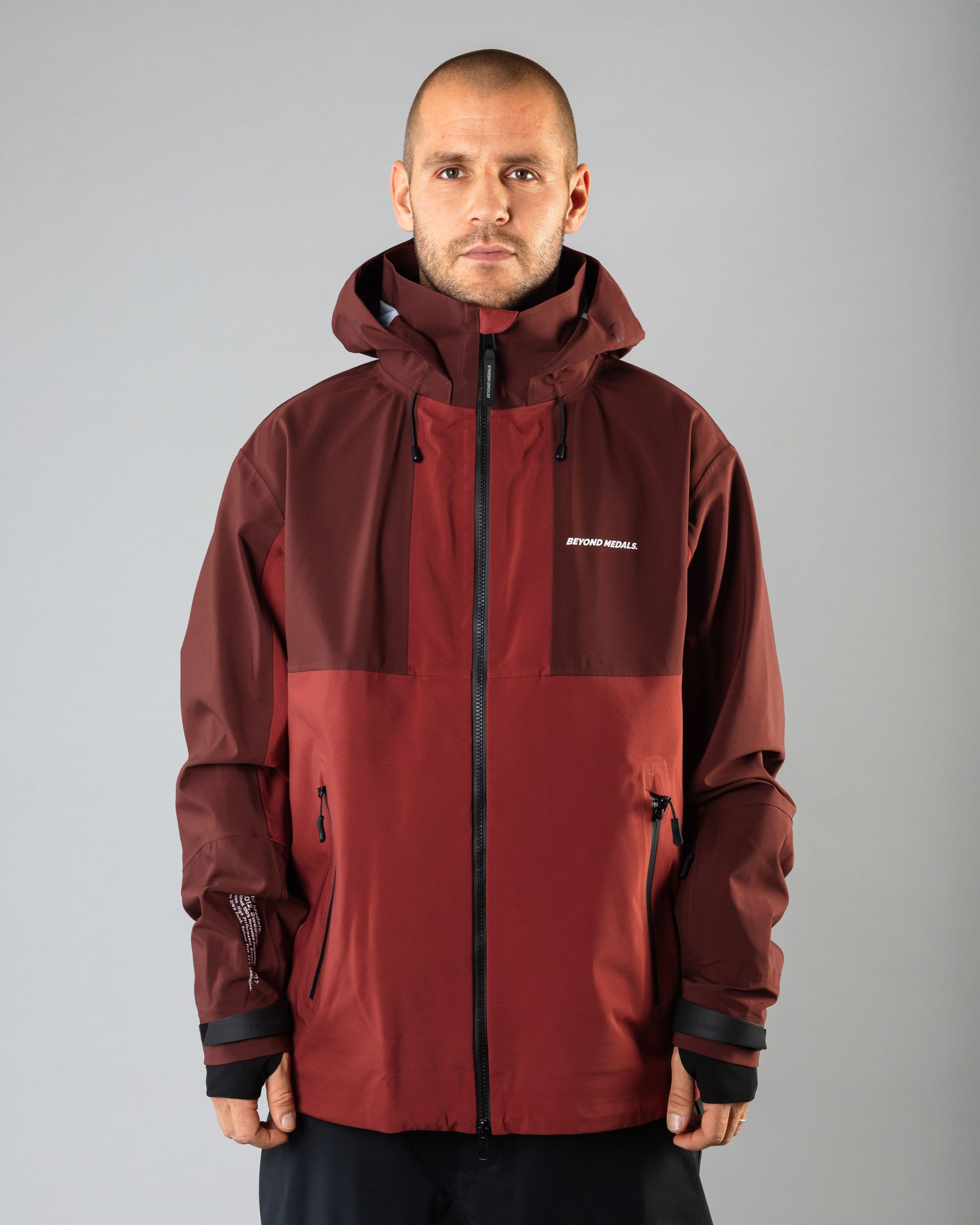 Outerwear clothing, tech jacket 3l in red worn by TOR LUNDSTRÖM, Beyond Medals, 2024, front