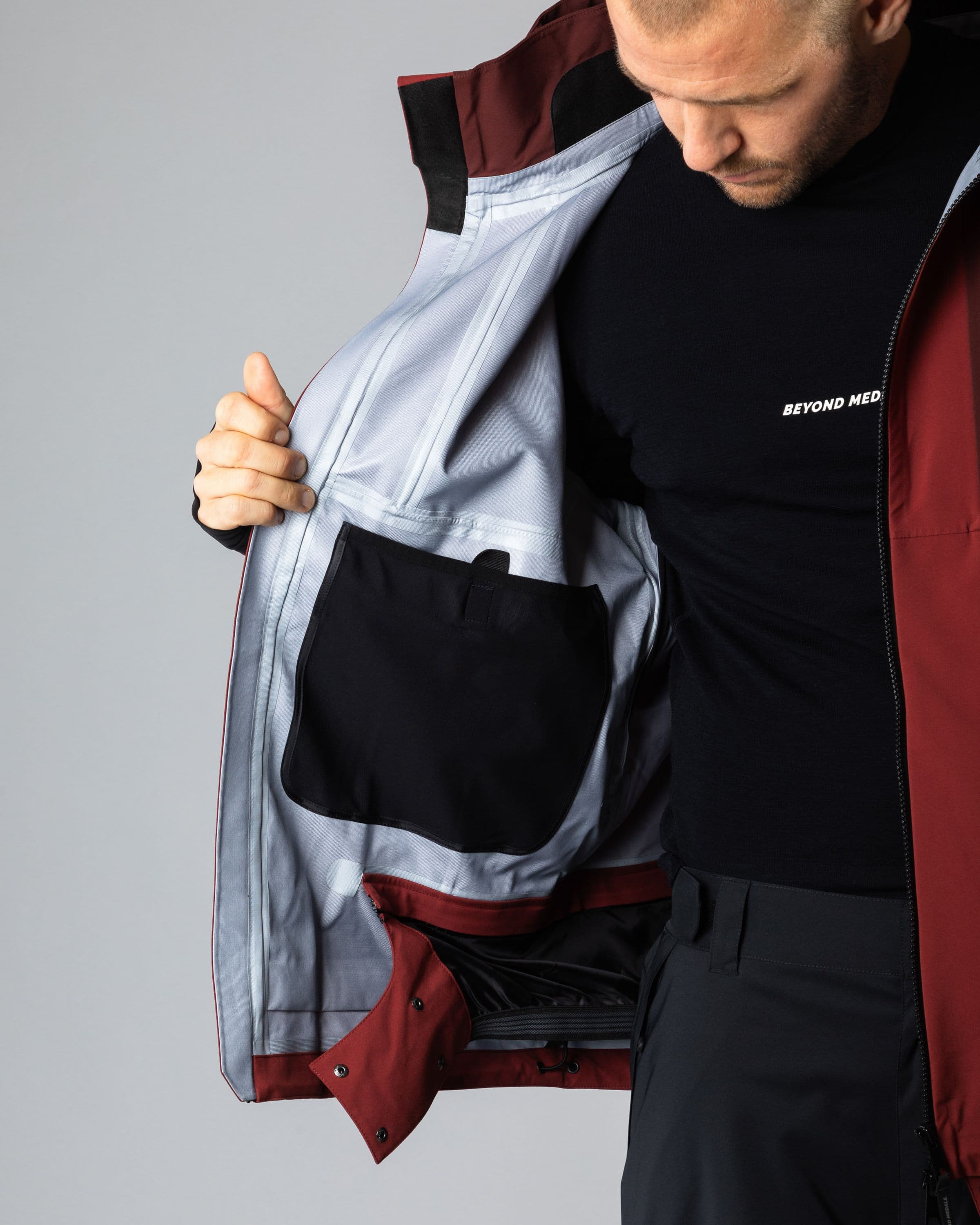 Outerwear clothing, tech jacket 3l in red worn by TOR LUNDSTRÖM, Beyond Medals, 2024, detail5