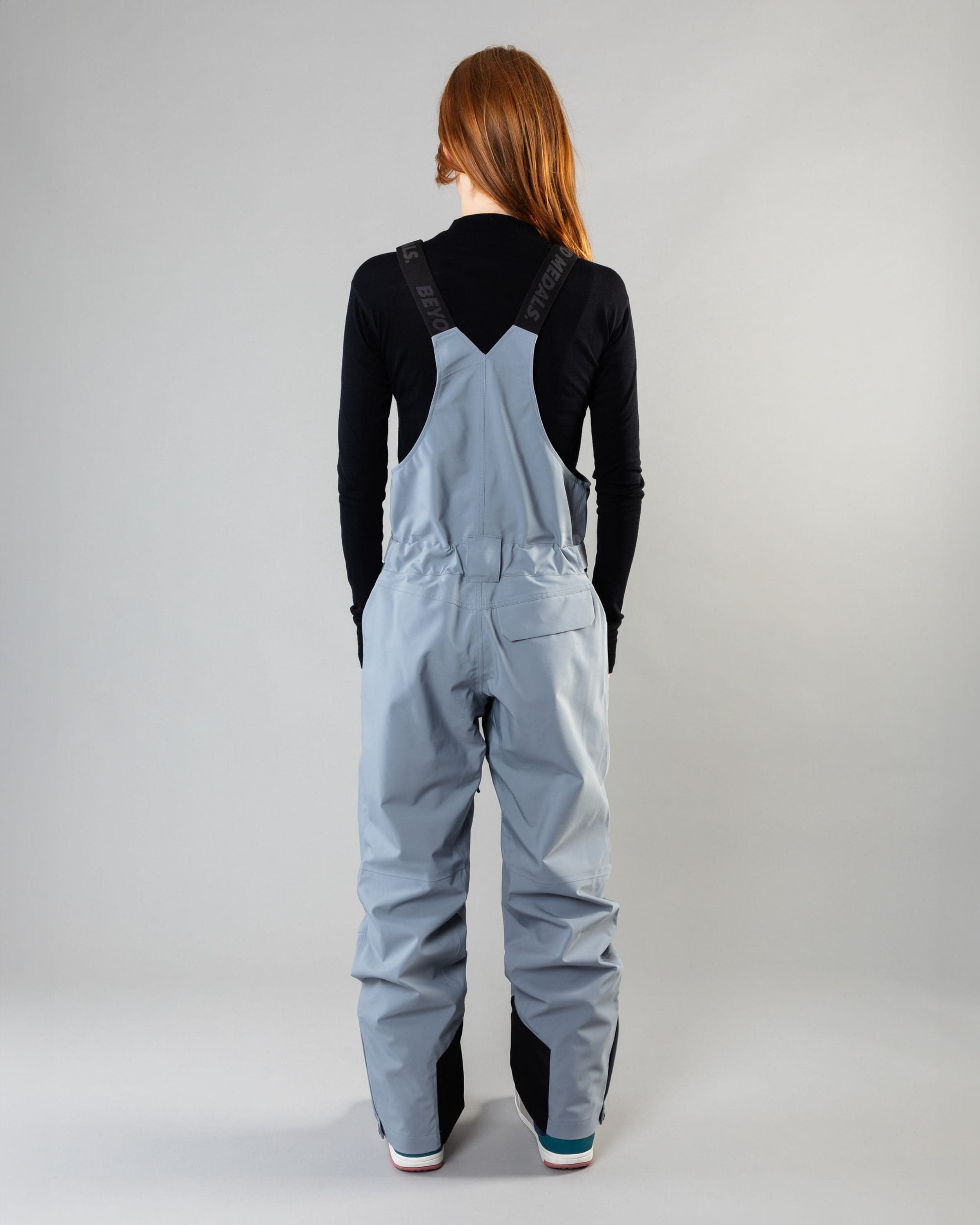 Outerwear clothing, tech bib 3l in pale blue worn by model, Beyond Medals, 2024, back