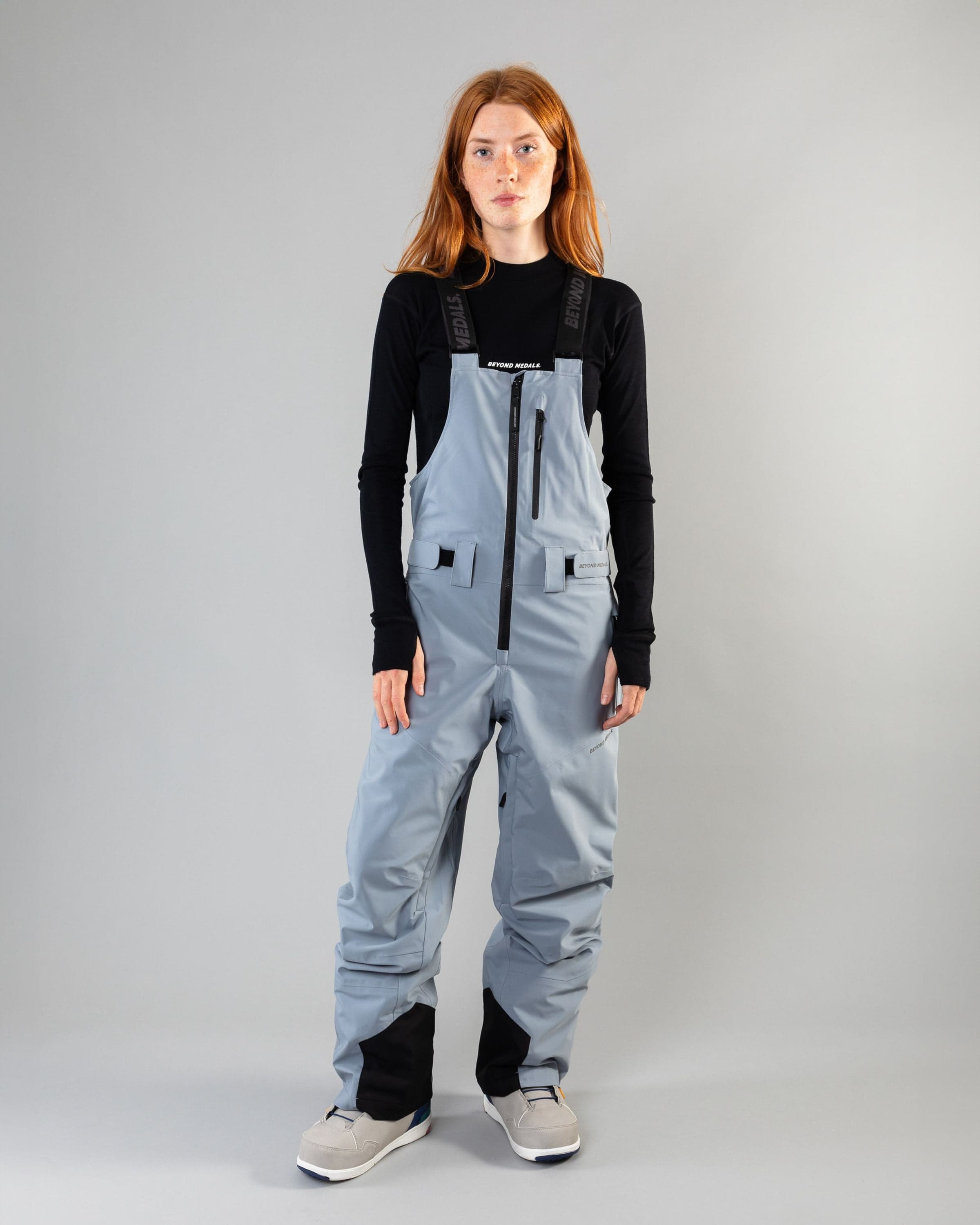 Outerwear clothing, tech bib 3l in pale blue worn by model, Beyond Medals, 2024, front