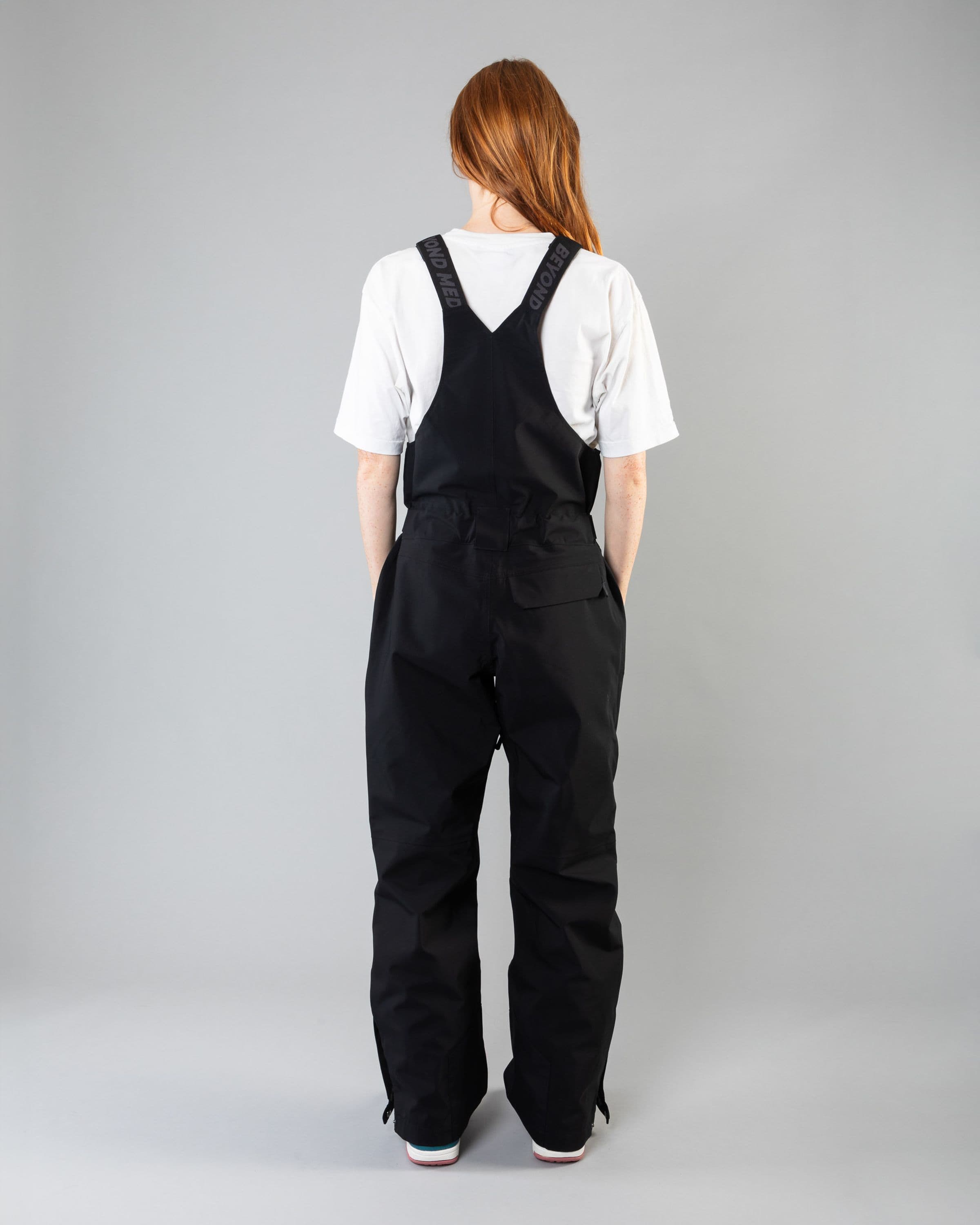 Outerwear clothing, tech bib 3l in black worn by model, Beyond Medals, 2024, back