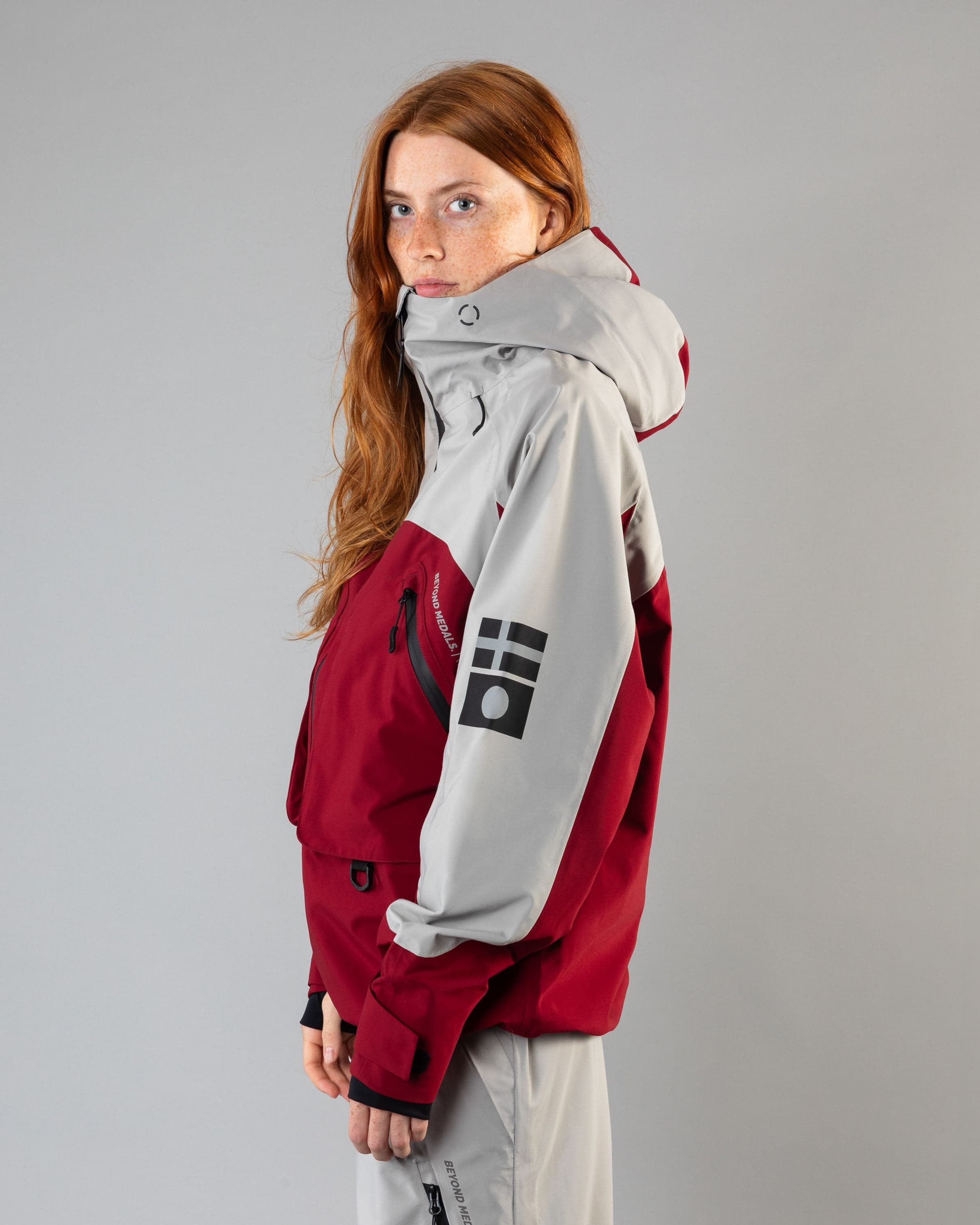 Outerwear clothing, beyond medals x nomadik jacket 3l in red worn by model, Beyond Medals, 2024, side