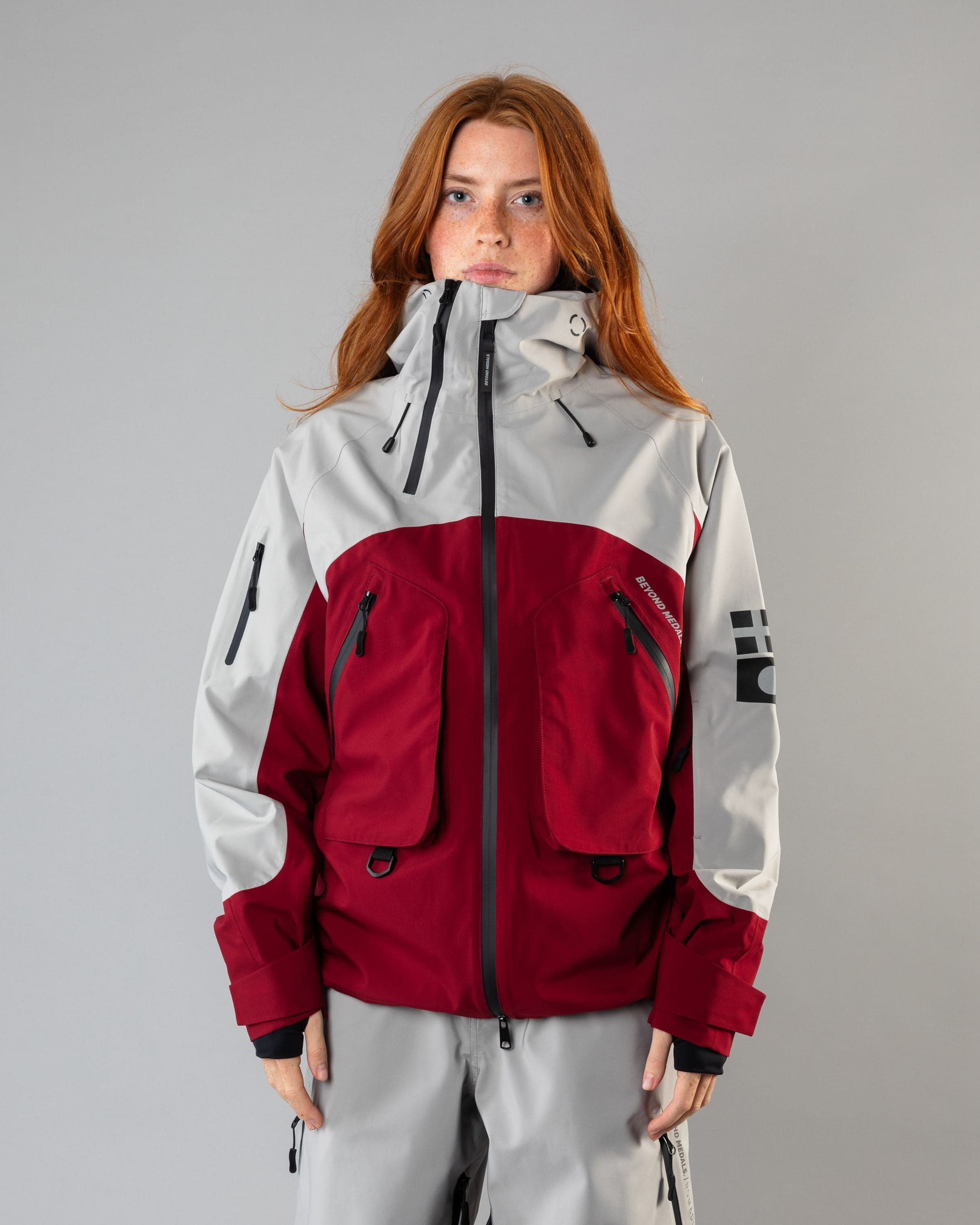 Outerwear clothing, beyond medals x nomadik jacket 3l in red worn by model, Beyond Medals, 2024, front