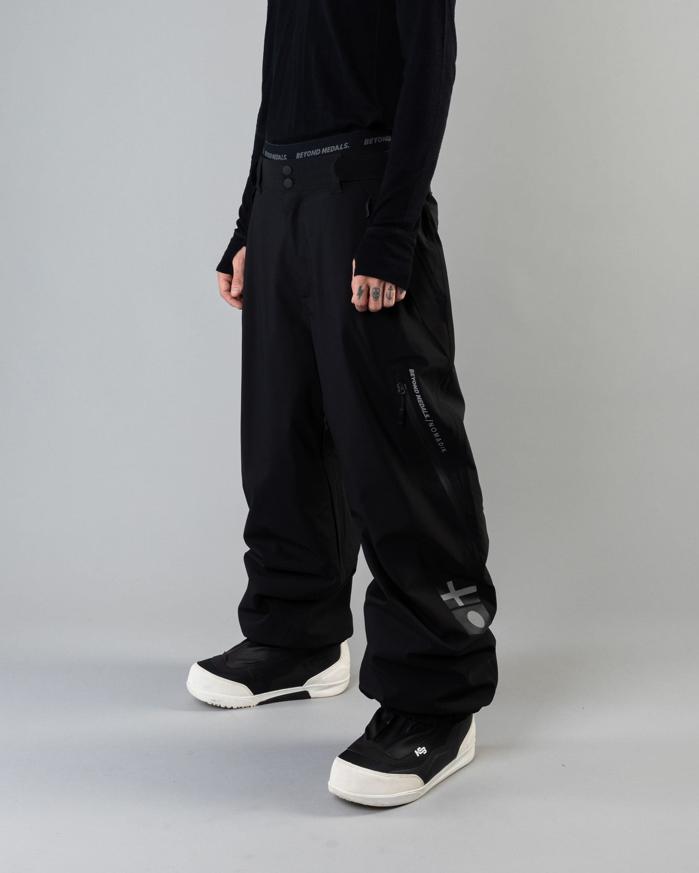 Outerwear clothing, beyond medals x nomadik pants 3l in black worn by KEVIN BÄCKSTRÖM, Beyond Medals, 2024, front