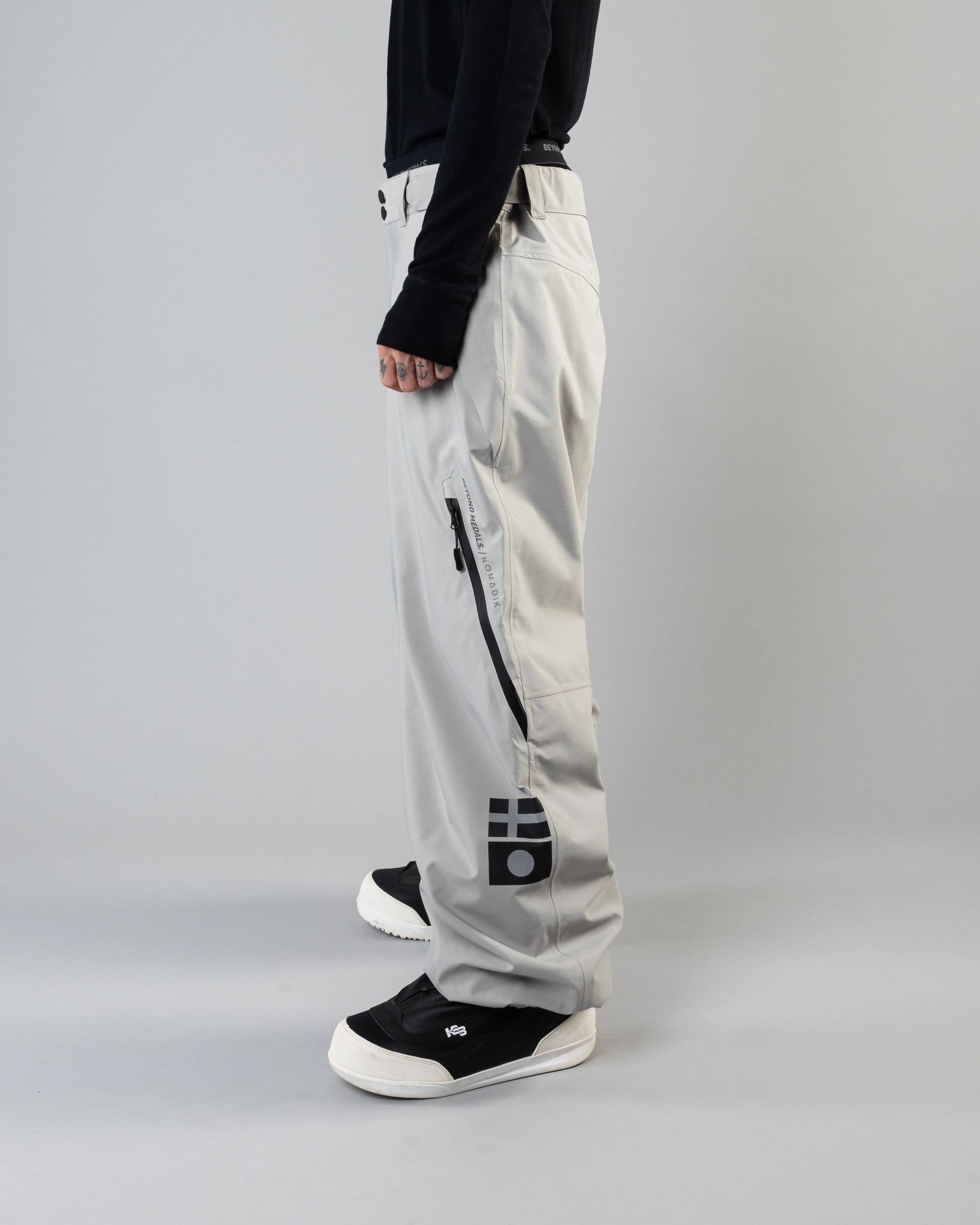 Outerwear clothing, beyond medals x nomadik pants 3l in grey worn by KEVIN BÄCKSTRÖM, Beyond Medals, 2024, side