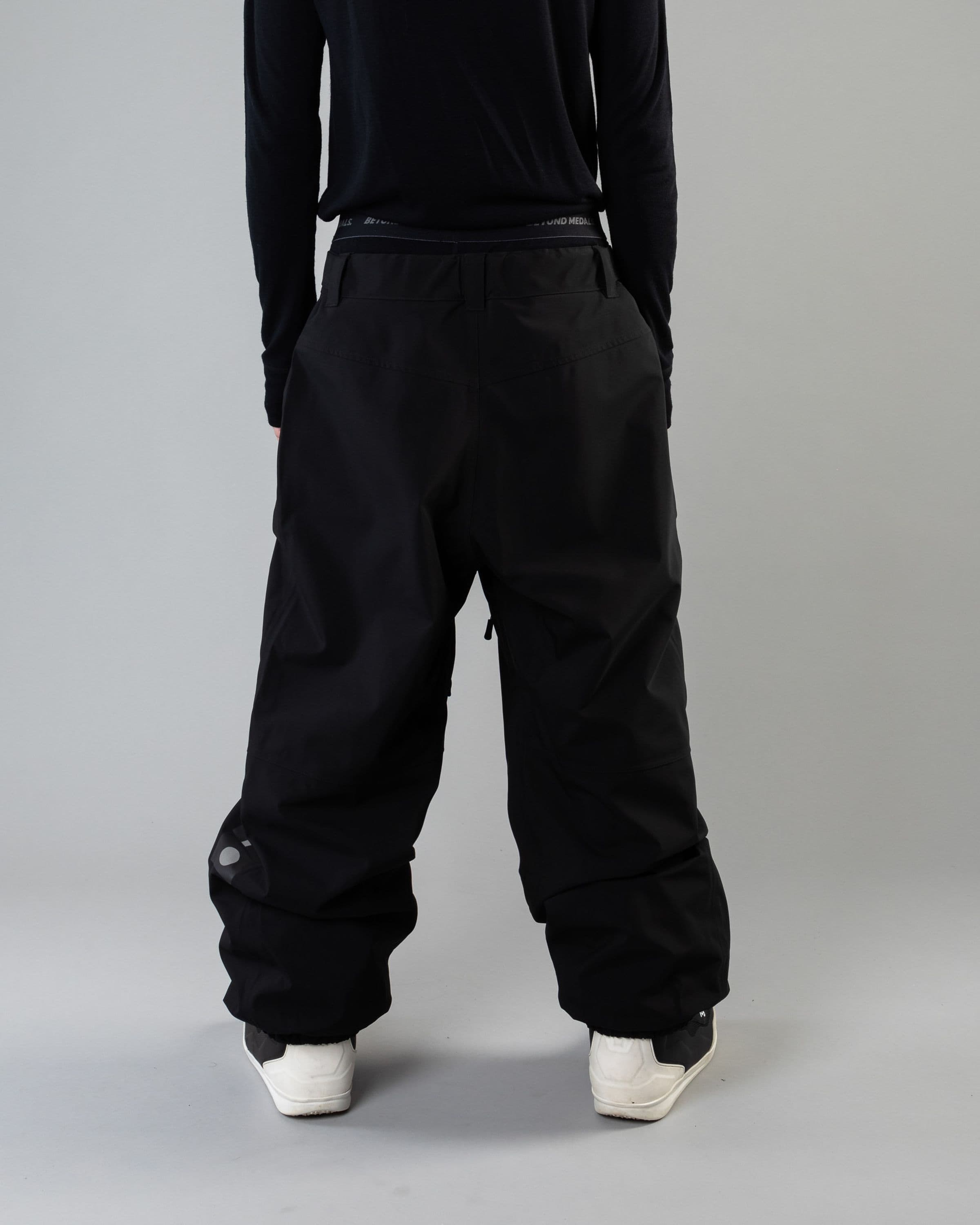 Outerwear clothing, beyond medals x nomadik pants 3l in black worn by KEVIN BÄCKSTRÖM, Beyond Medals, 2024, back