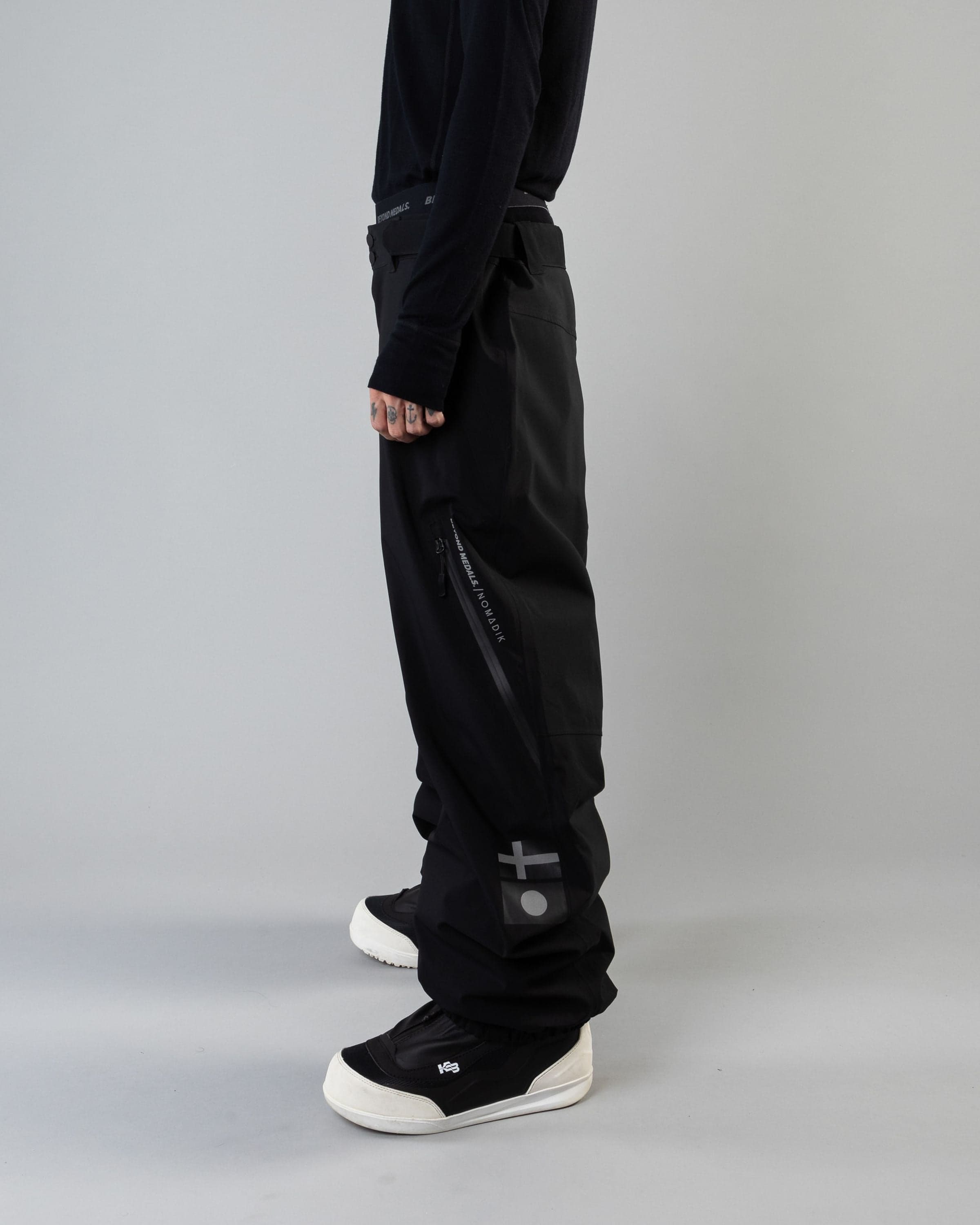 Outerwear clothing, beyond medals x nomadik pants 3l in black worn by KEVIN BÄCKSTRÖM, Beyond Medals, 2024, side