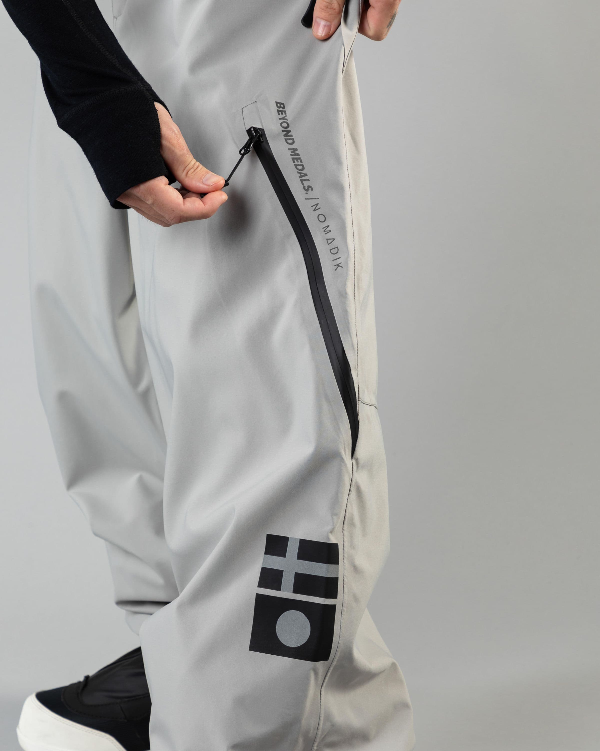 Outerwear clothing, beyond medals x nomadik pants 3l in grey worn by KEVIN BÄCKSTRÖM, Beyond Medals, 2024, detail1