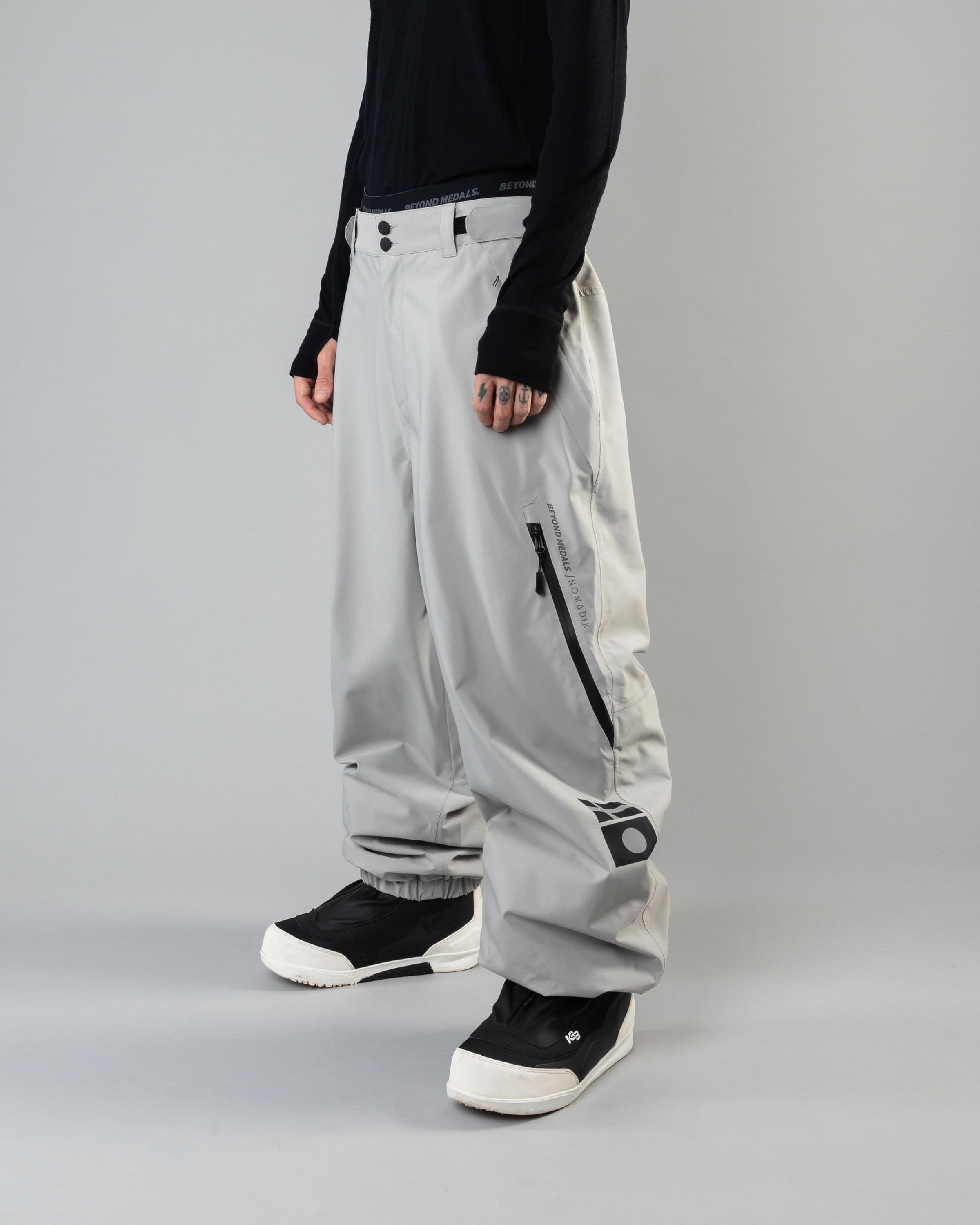 Outerwear clothing, beyond medals x nomadik pants 3l in grey worn by KEVIN BÄCKSTRÖM, Beyond Medals, 2024, front