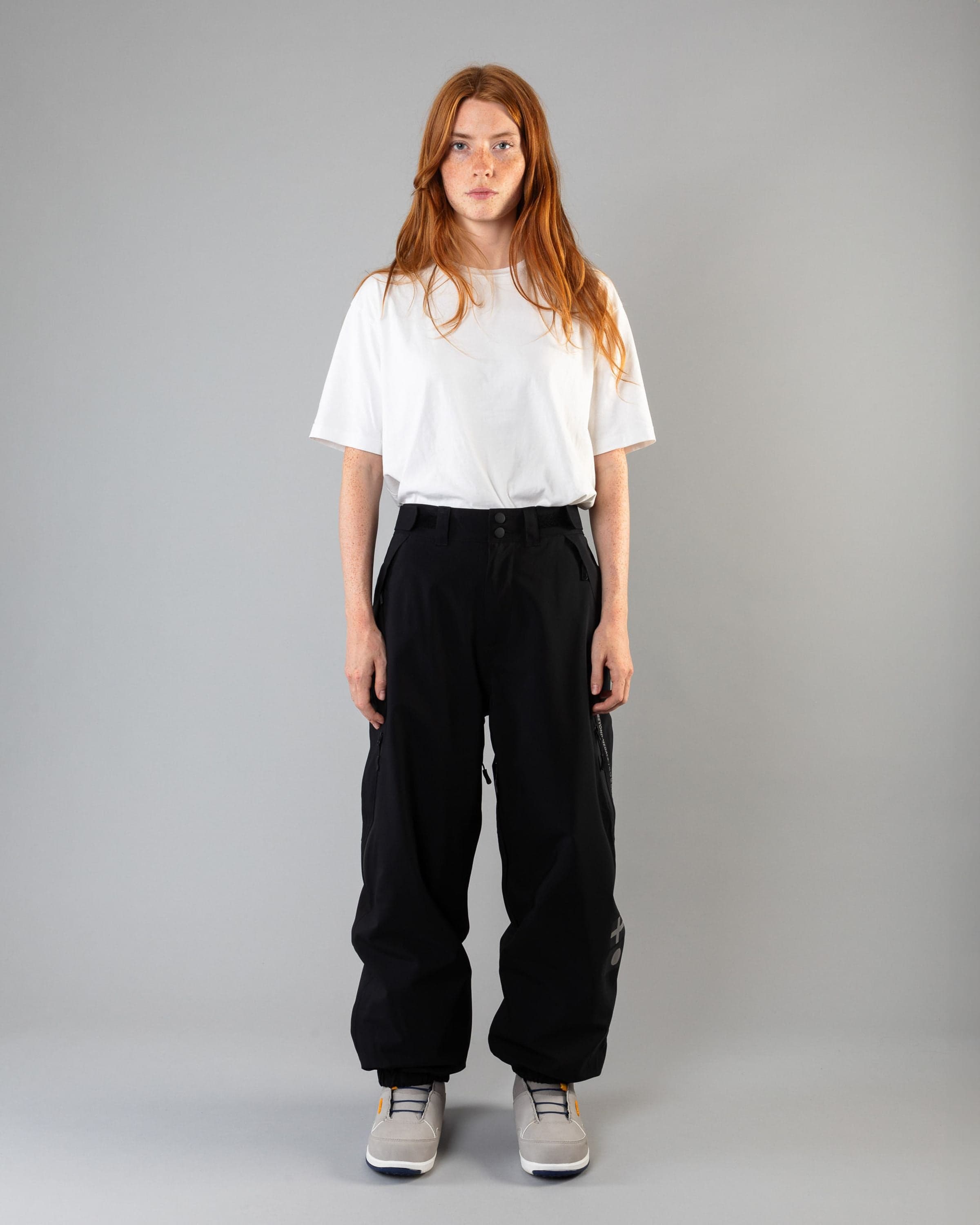 Outerwear clothing, beyond medals x nomadik pants 3l in black worn by model, Beyond Medals, 2024, full front