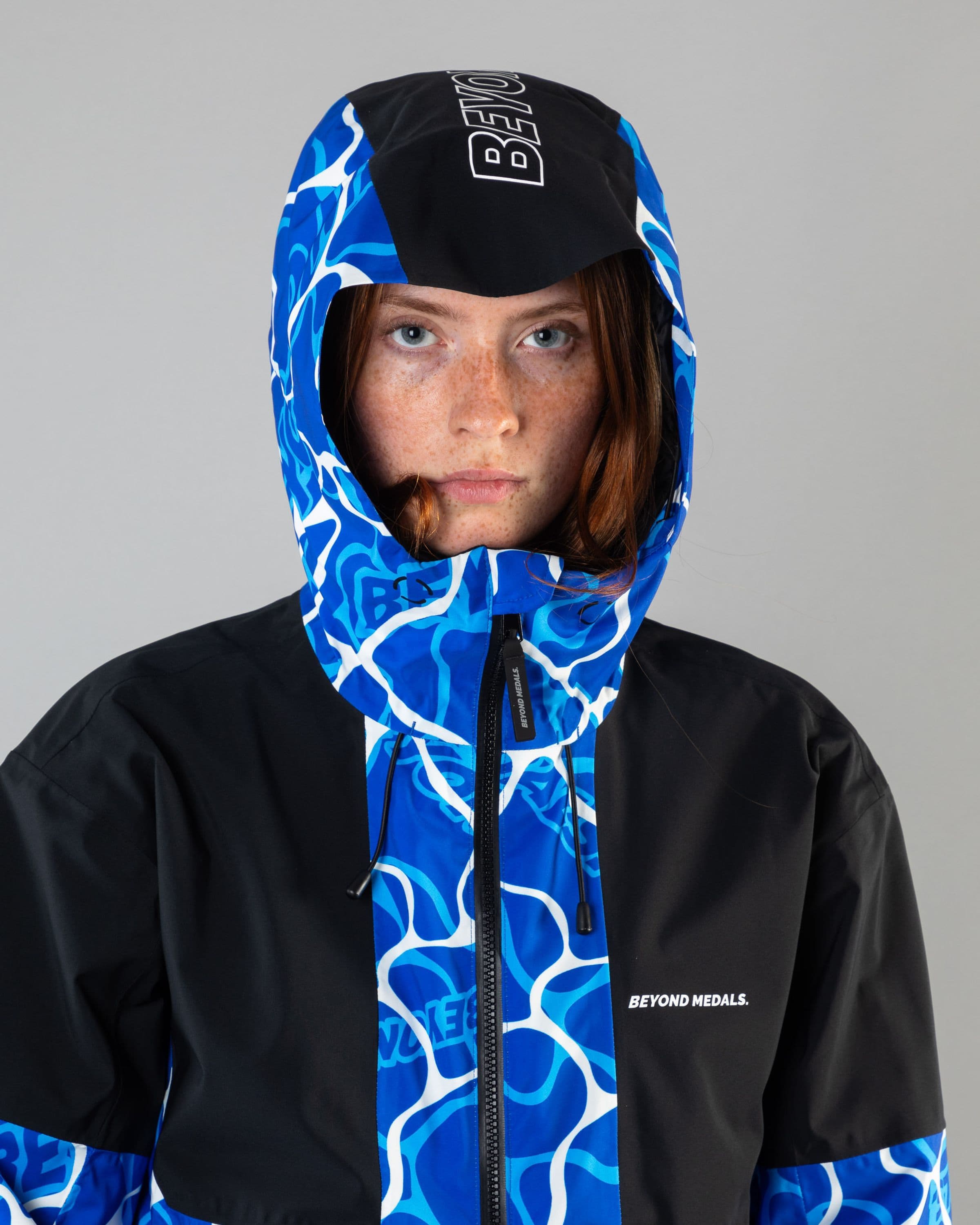 Outerwear clothing, fullzip jacket 2l in blue worn by model, Beyond Medals, 2024, detail1