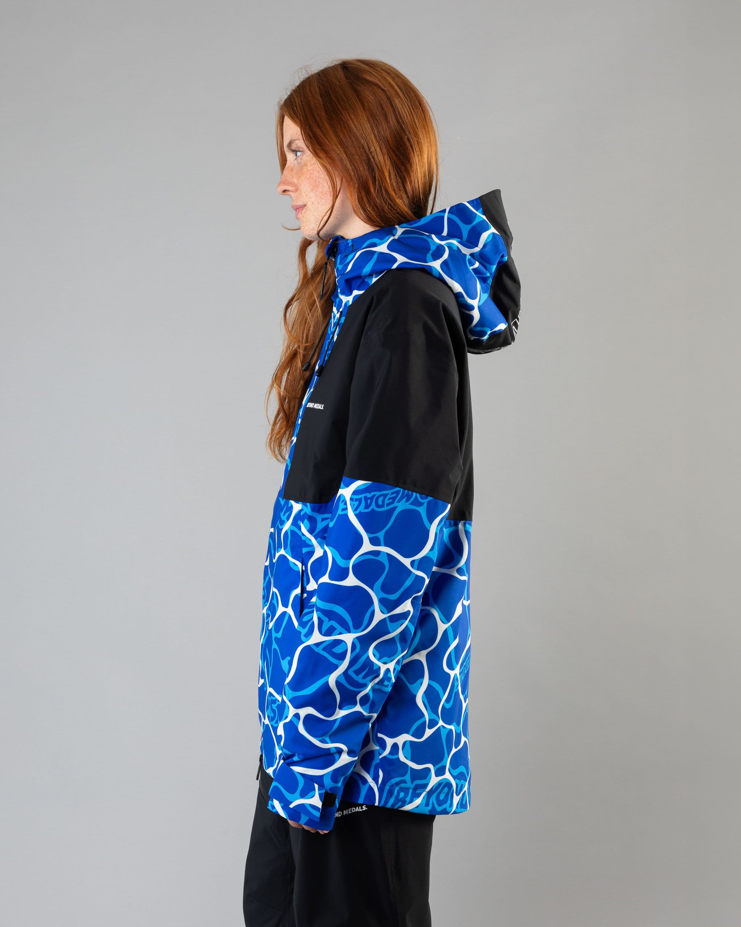 Outerwear clothing, fullzip jacket 2l in blue worn by model, Beyond Medals, 2024, side