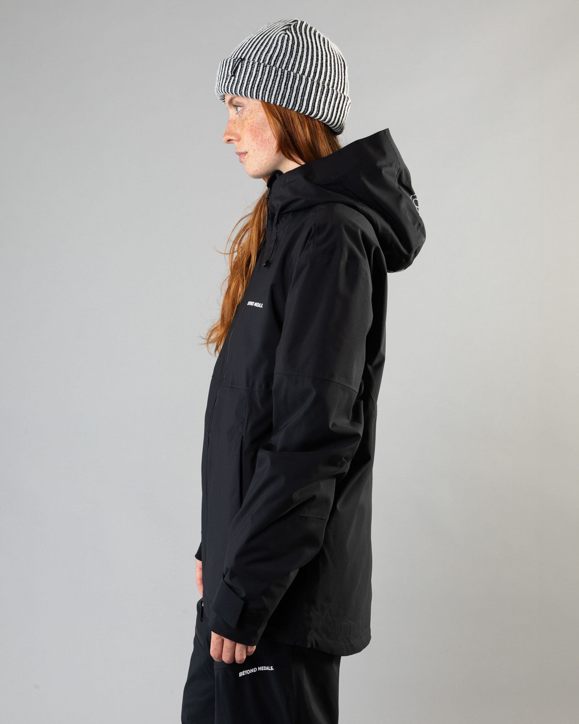 Outerwear clothing, fullzip jacket 2l in black worn by model, Beyond Medals, 2024, side