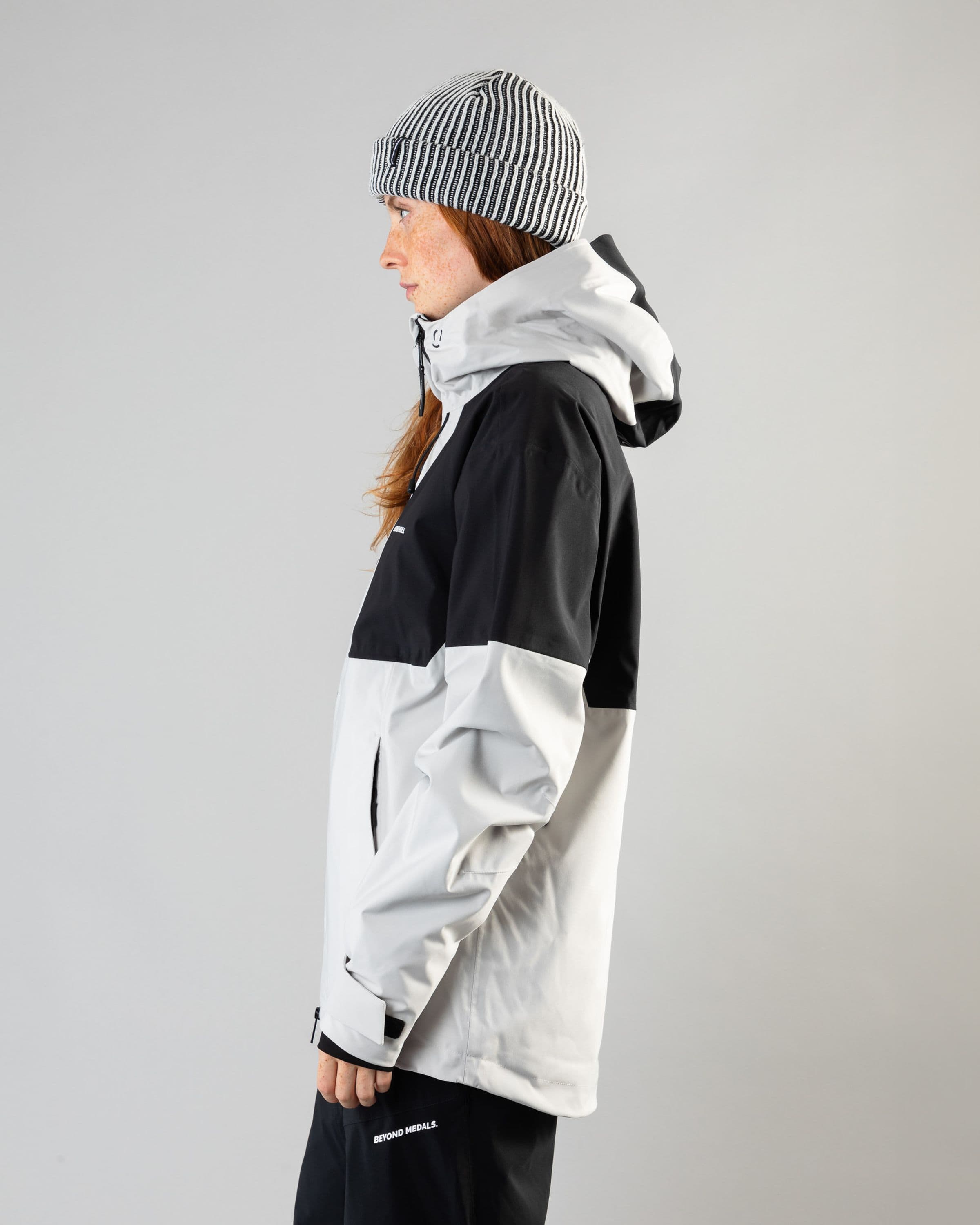 Outerwear clothing, fullzip jacket 2l in grey worn by model, Beyond Medals, 2024, side