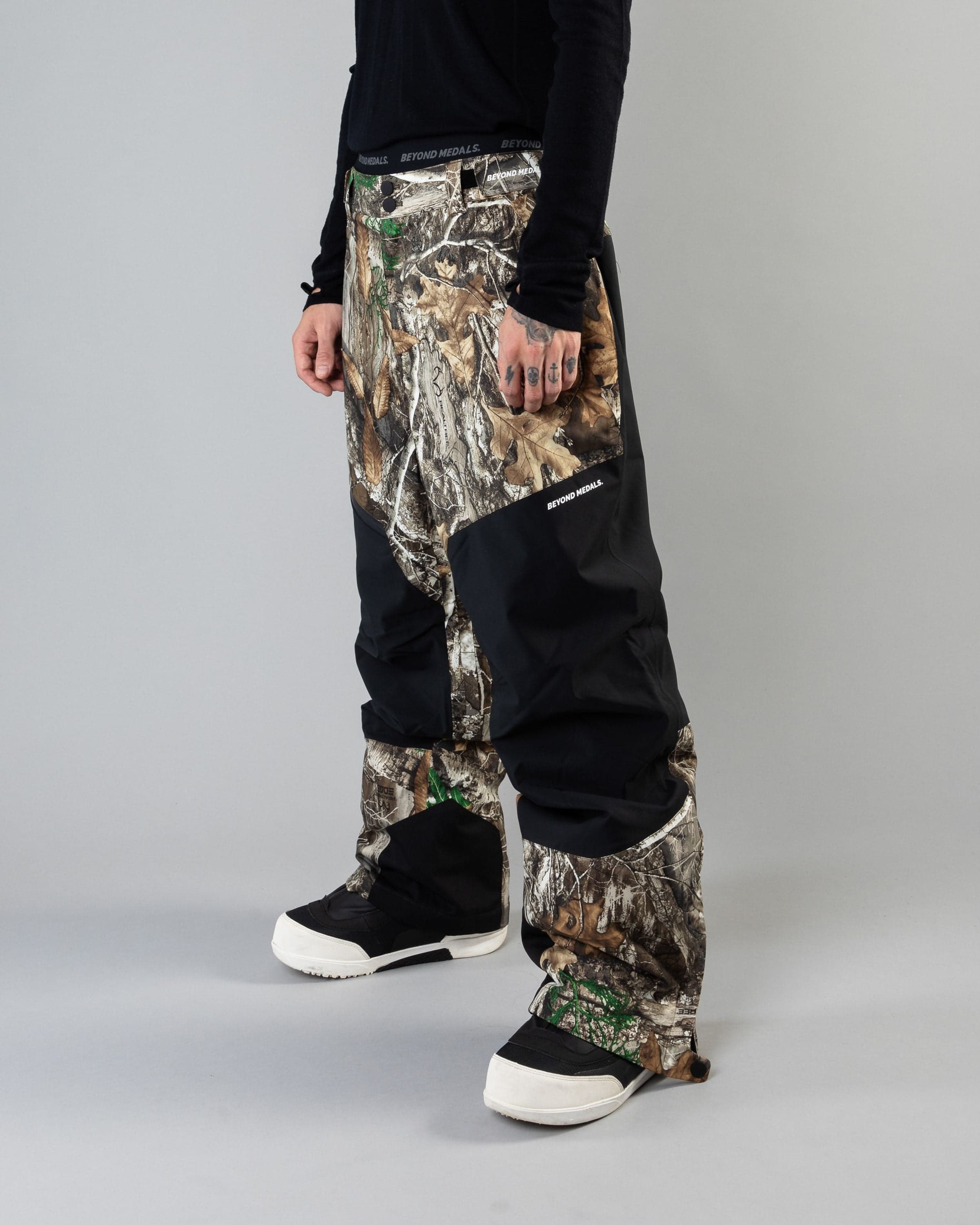 Outerwear clothing, zip pants 2l in realtree worn by KEVIN BÄCKSTRÖM, Beyond Medals, 2024, front