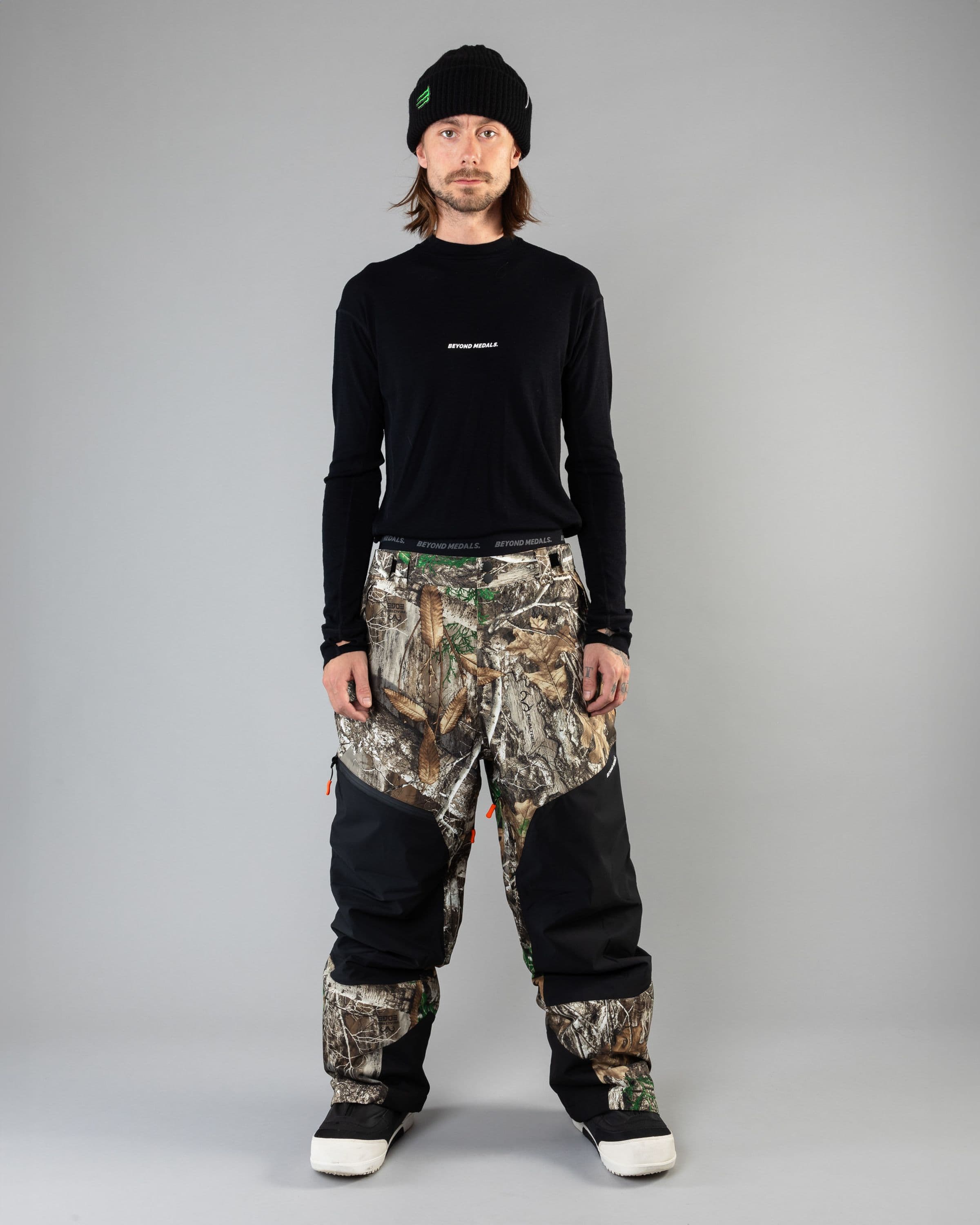 Outerwear clothing, zip pants 2l in realtree worn by KEVIN BÄCKSTRÖM, Beyond Medals, 2024, full front 2