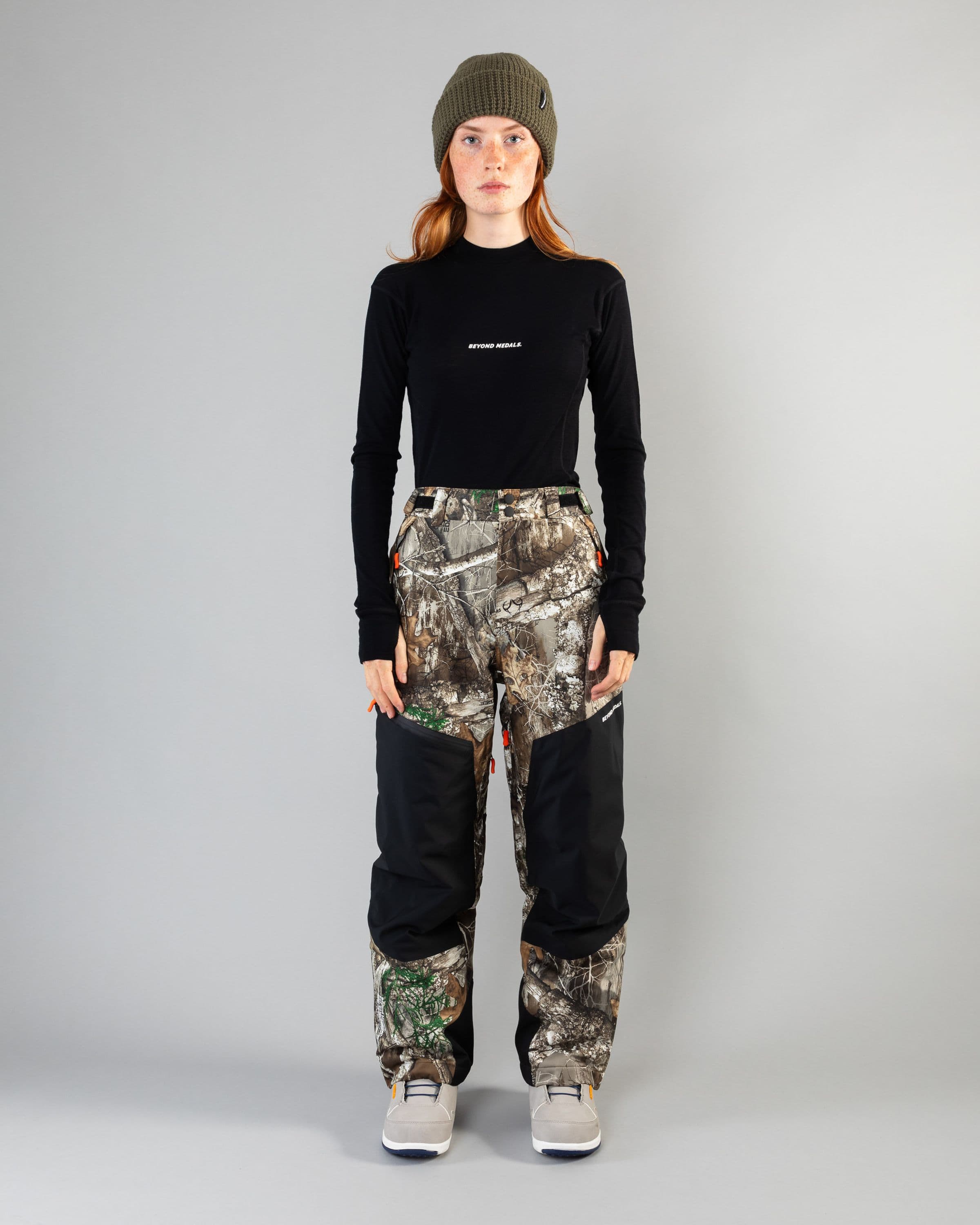 Outerwear clothing, zip pants 2l in realtree worn by model, Beyond Medals, 2024, fullfront2