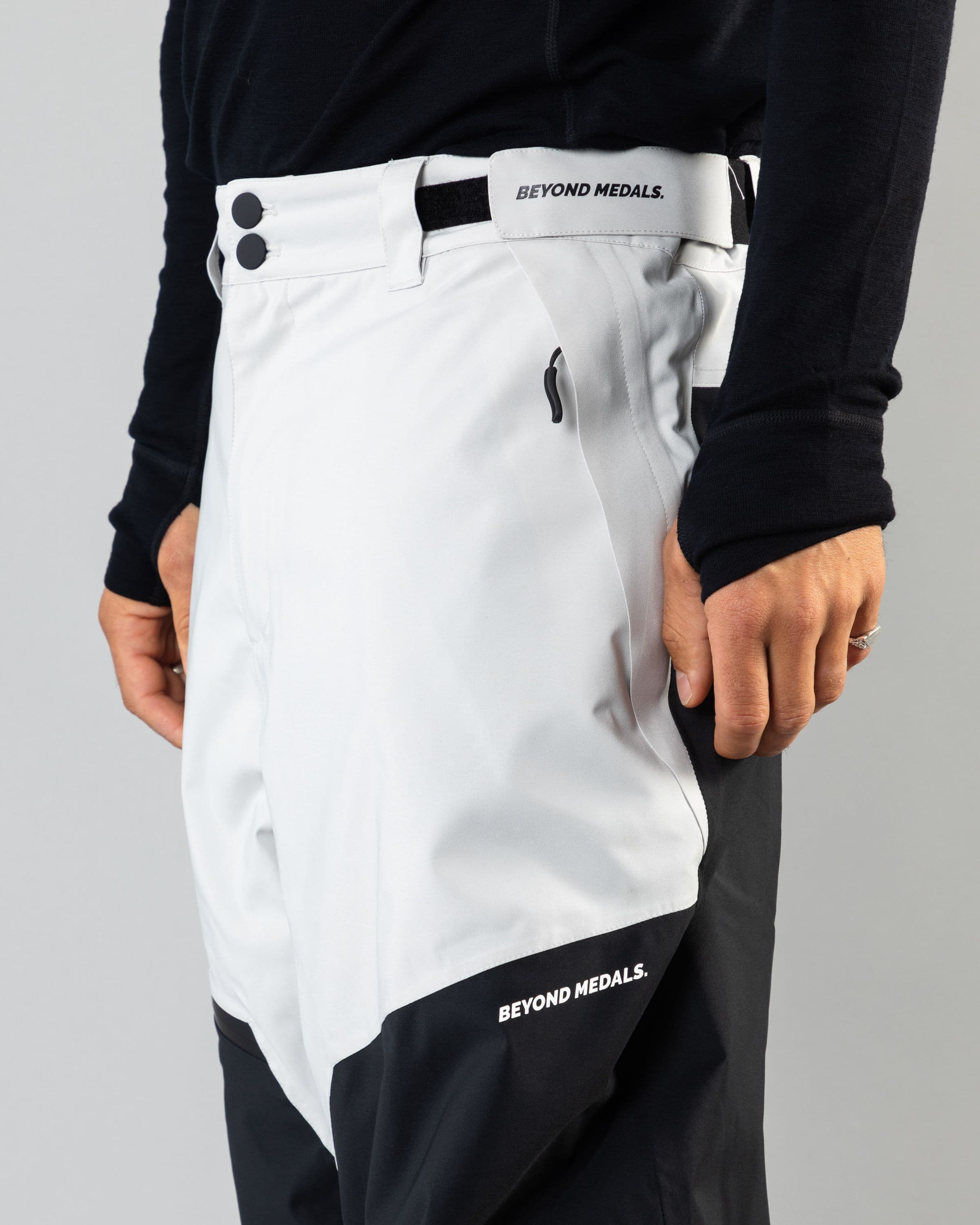 Outerwear clothing, zip pants 2l in grey worn by ULRIK BADERTSCHER, Beyond Medals, 2024, detail1