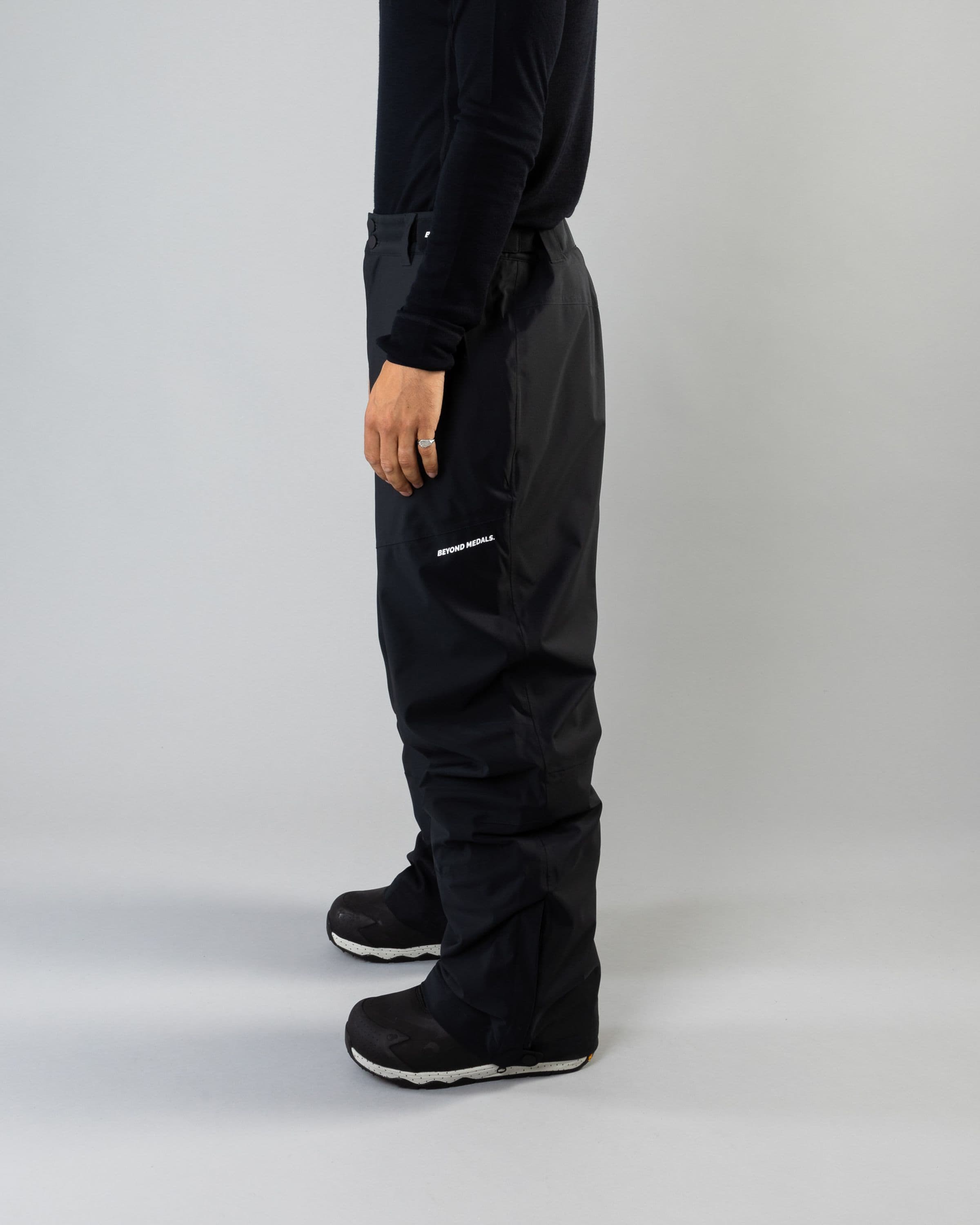 Outerwear clothing, zip pants 2l in black worn by ULRIK BADERTSCHER, Beyond Medals, 2024, side