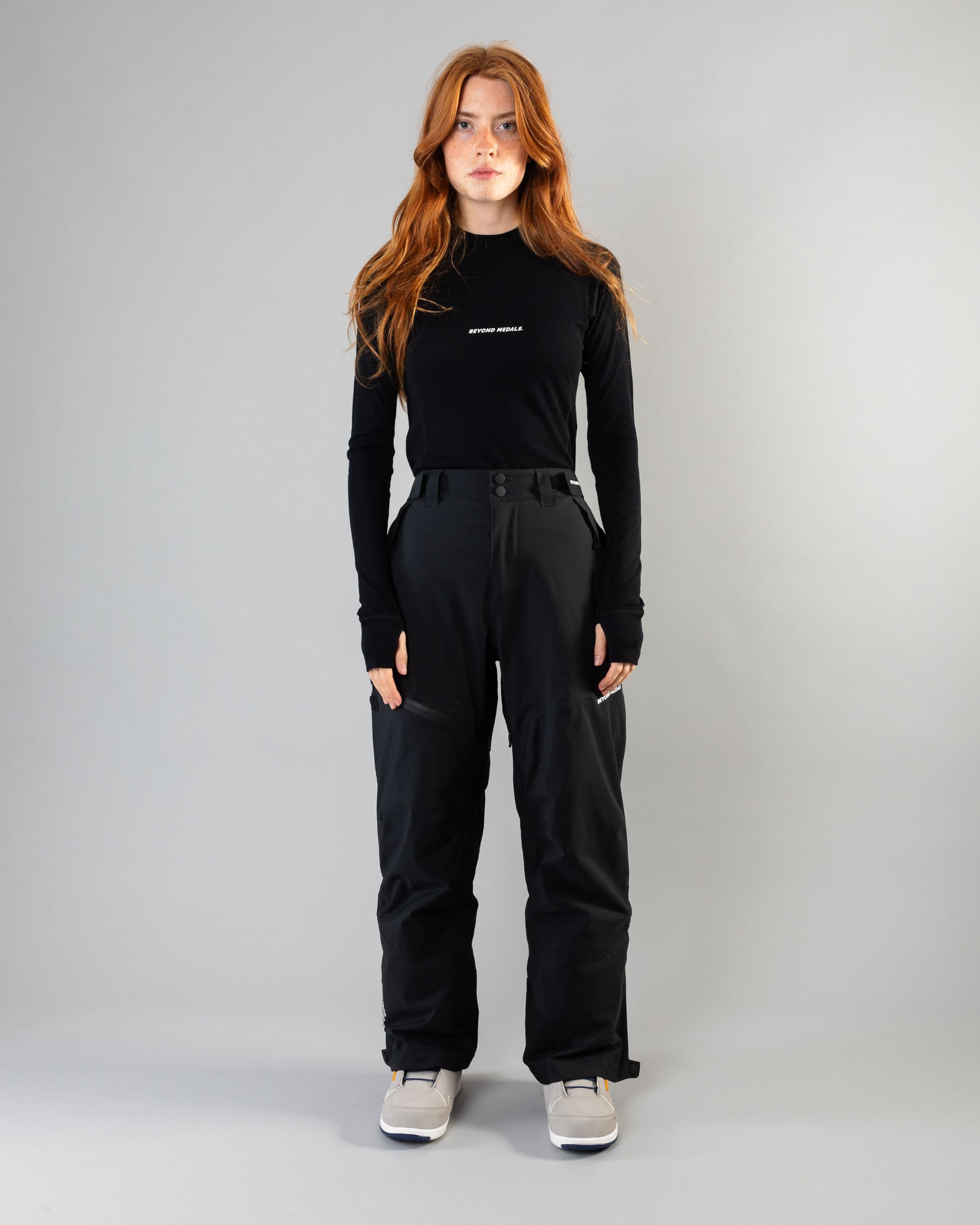 Outerwear clothing, zip pants 2l in black worn by model, Beyond Medals, 2024, full front