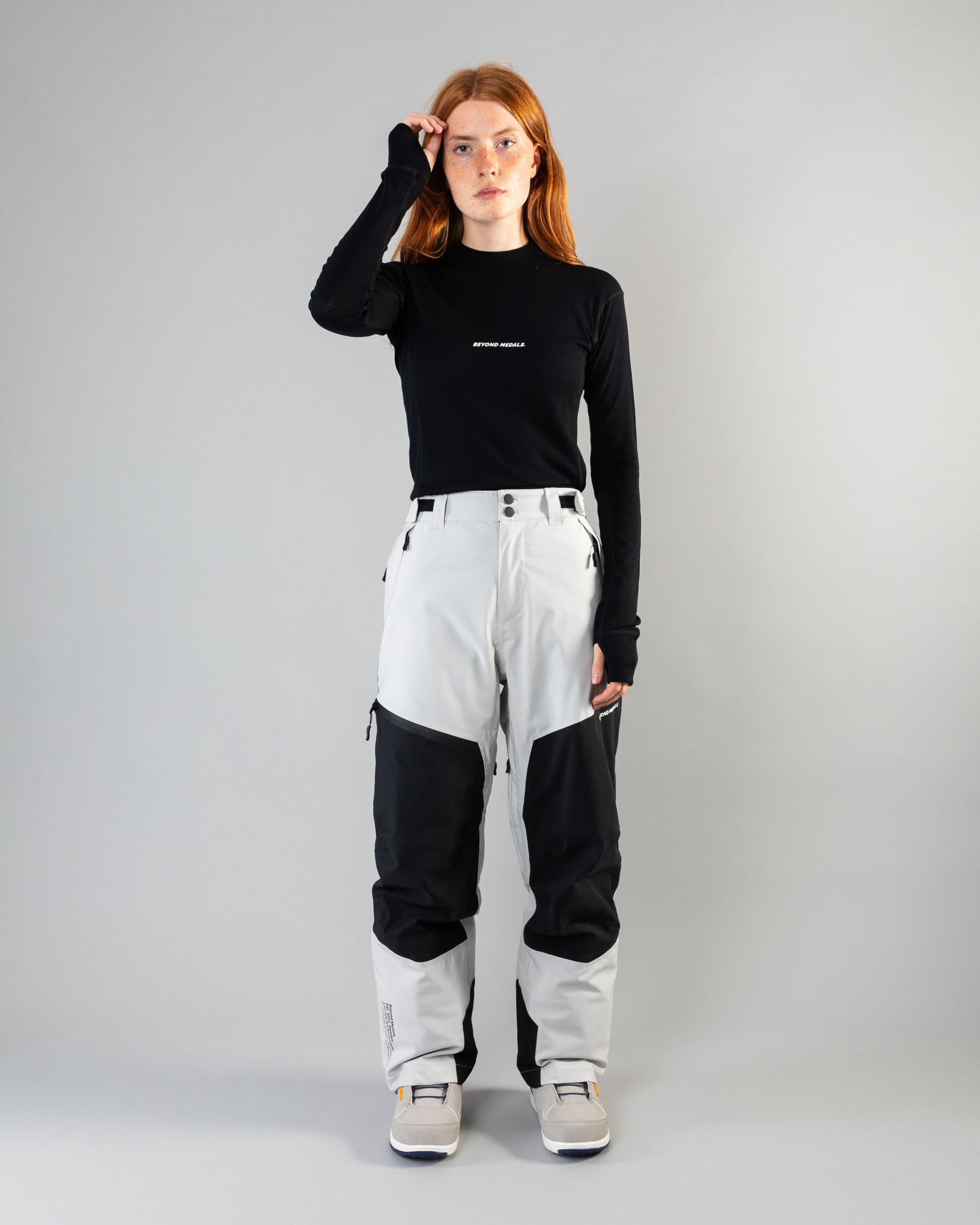 Outerwear clothing, zip pants 2l in grey worn by model, Beyond Medals, 2024, full front1