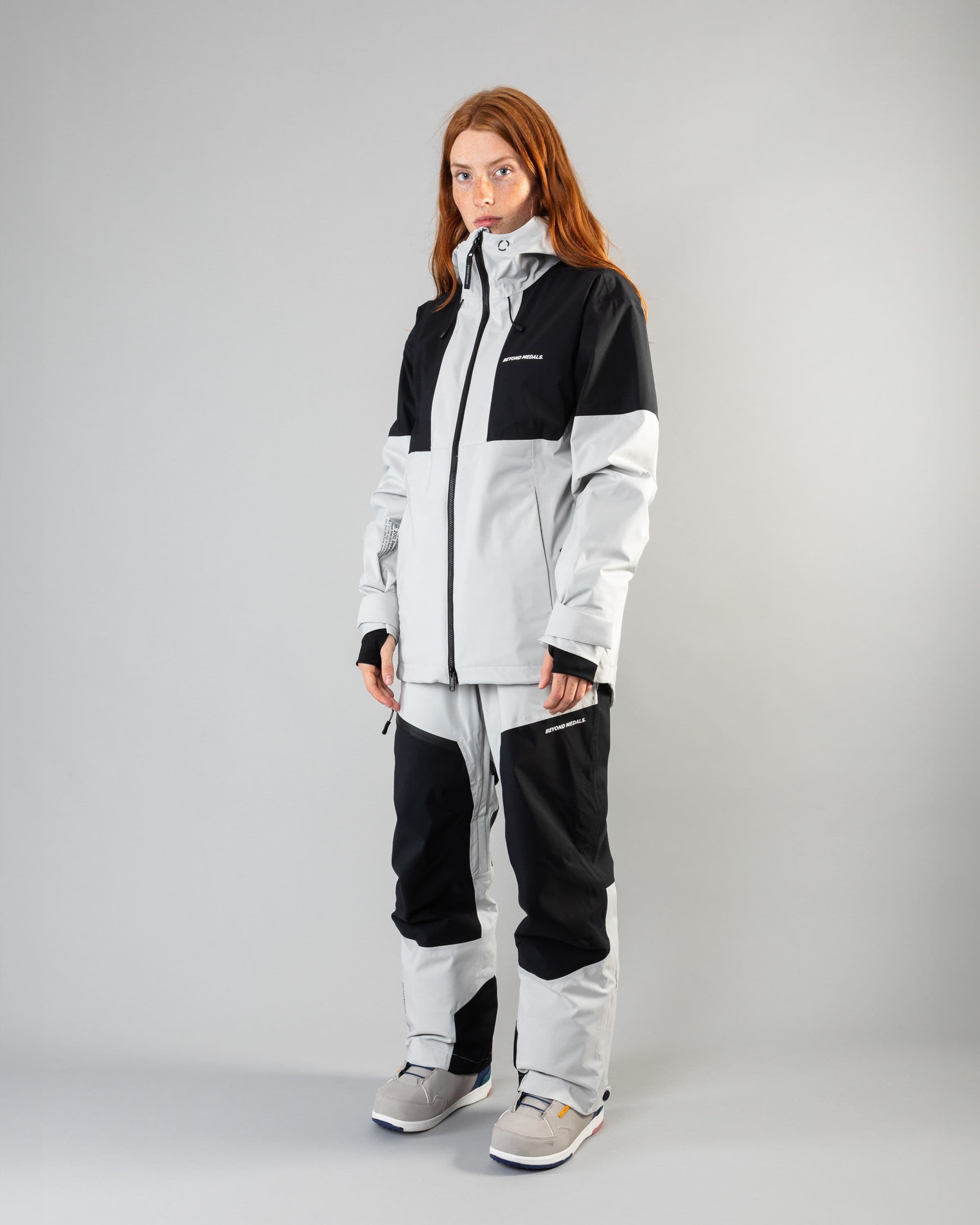 Outerwear clothing, zip pants 2l in grey worn by model, Beyond Medals, 2024, full front2