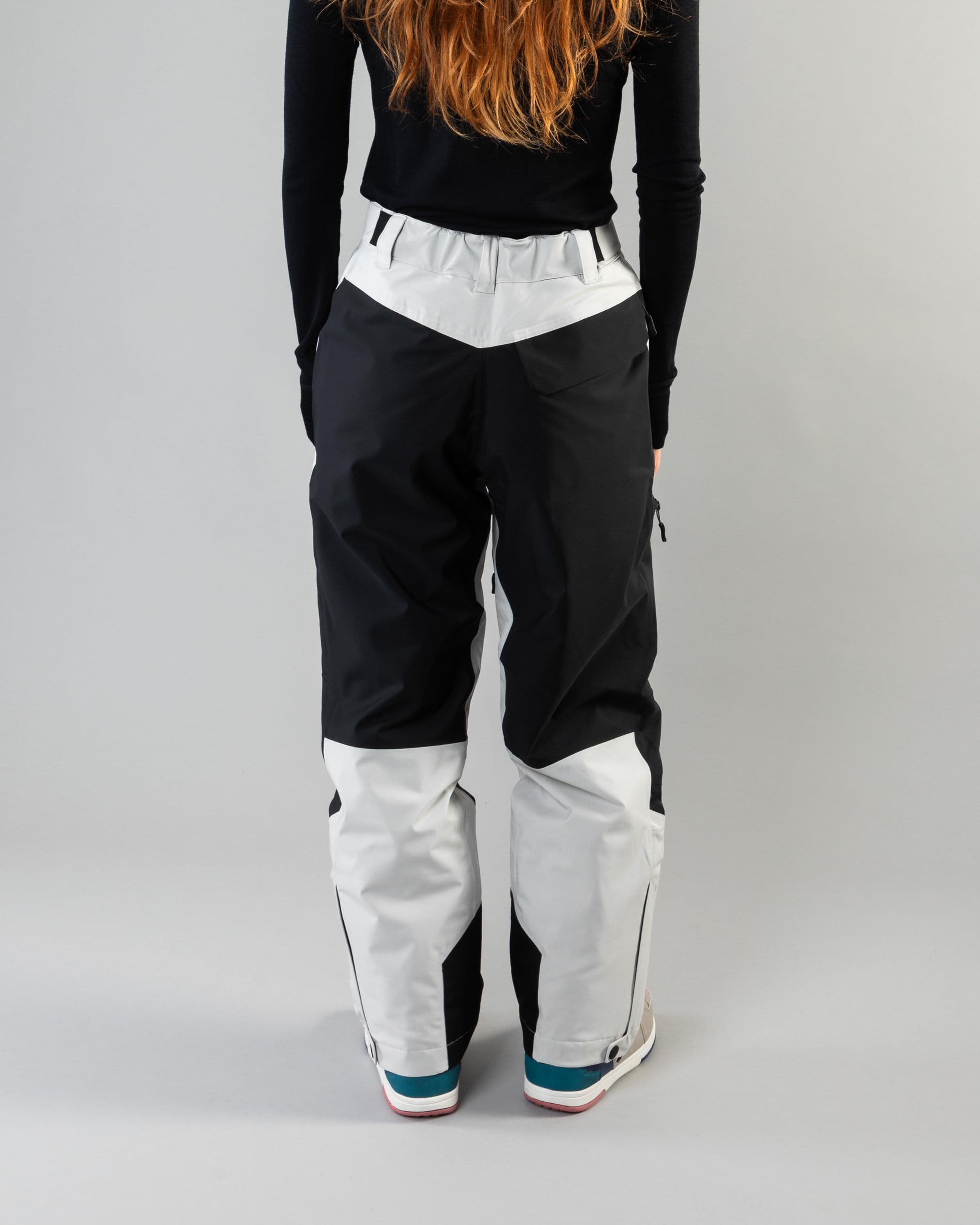 Outerwear clothing, zip pants 2l in grey worn by model, Beyond Medals, 2024, back