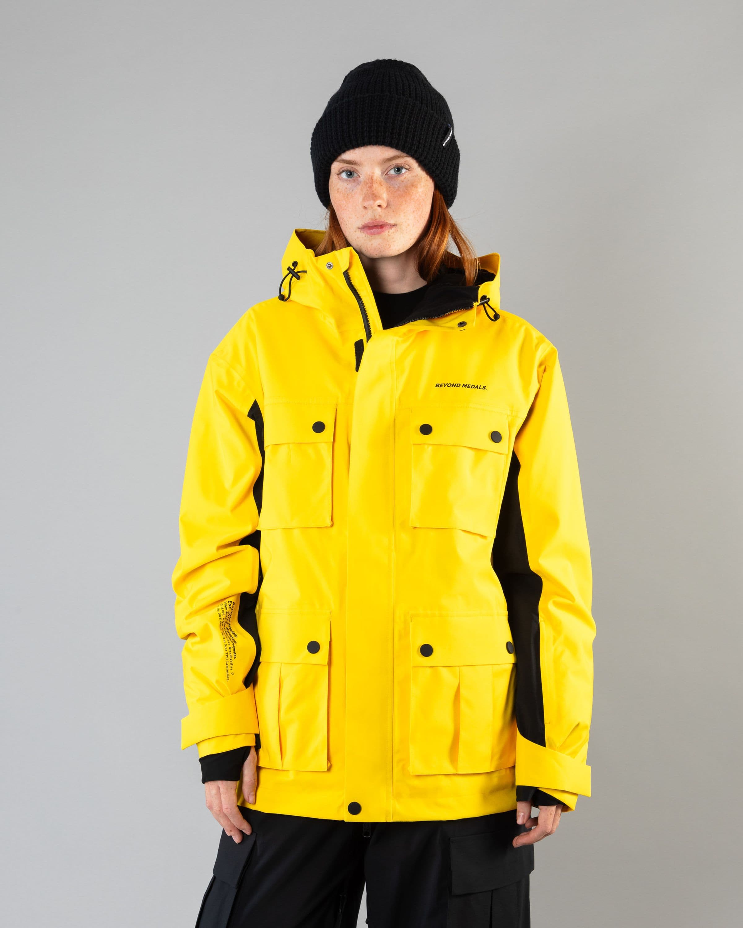 Outerwear clothing, cargo jacket 2l in yellow worn by model, Beyond Medals, 2024, front