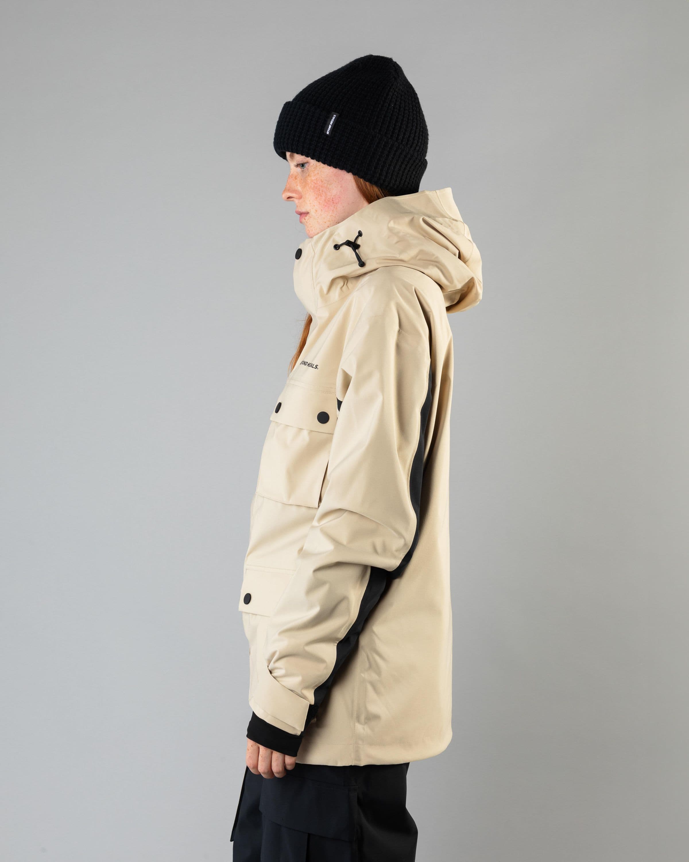 Outerwear clothing, cargo jacket 2l in beige worn by model, Beyond Medals, 2024, side