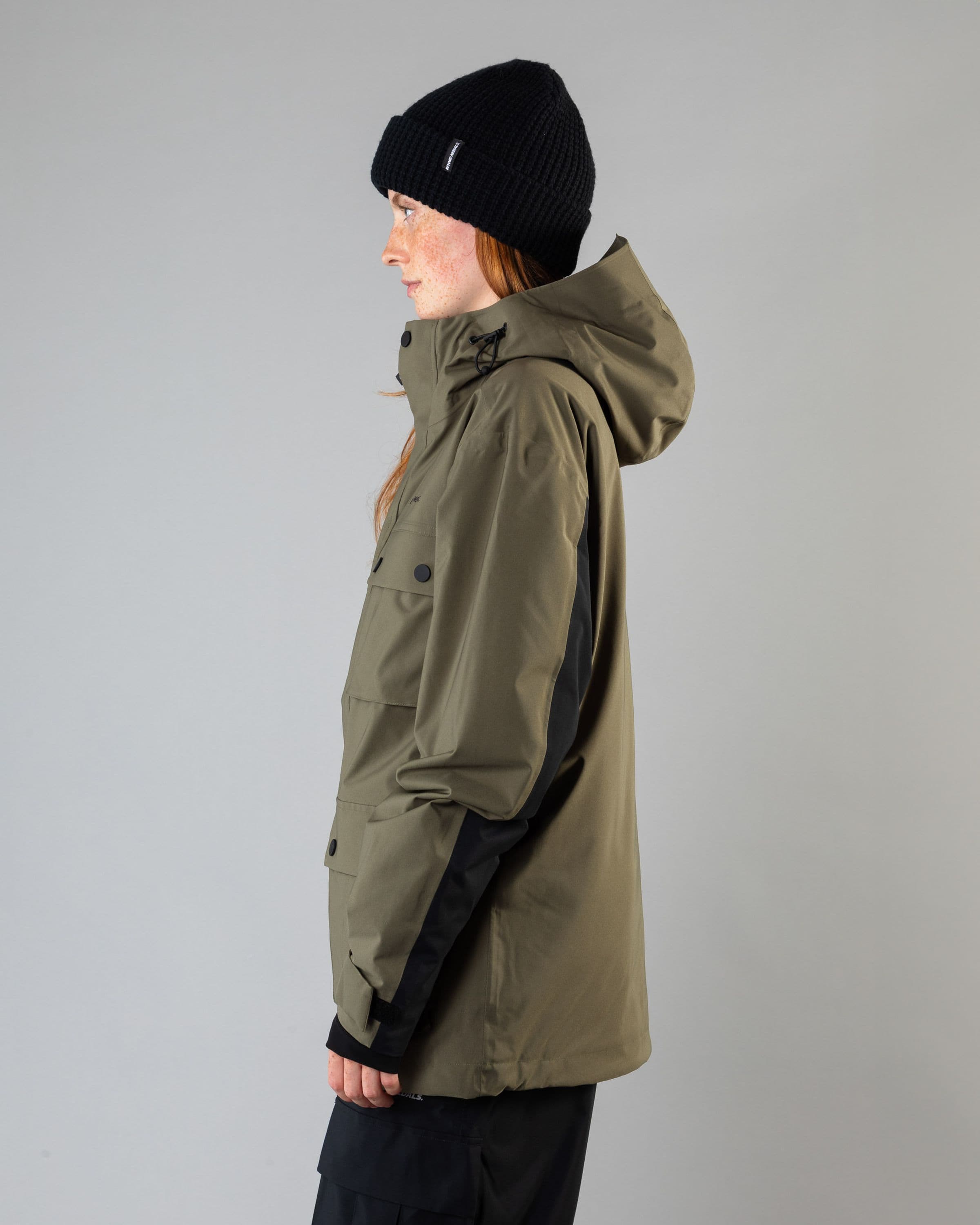 Outerwear clothing, cargo jacket 2l in green worn by model, Beyond Medals, 2024, side