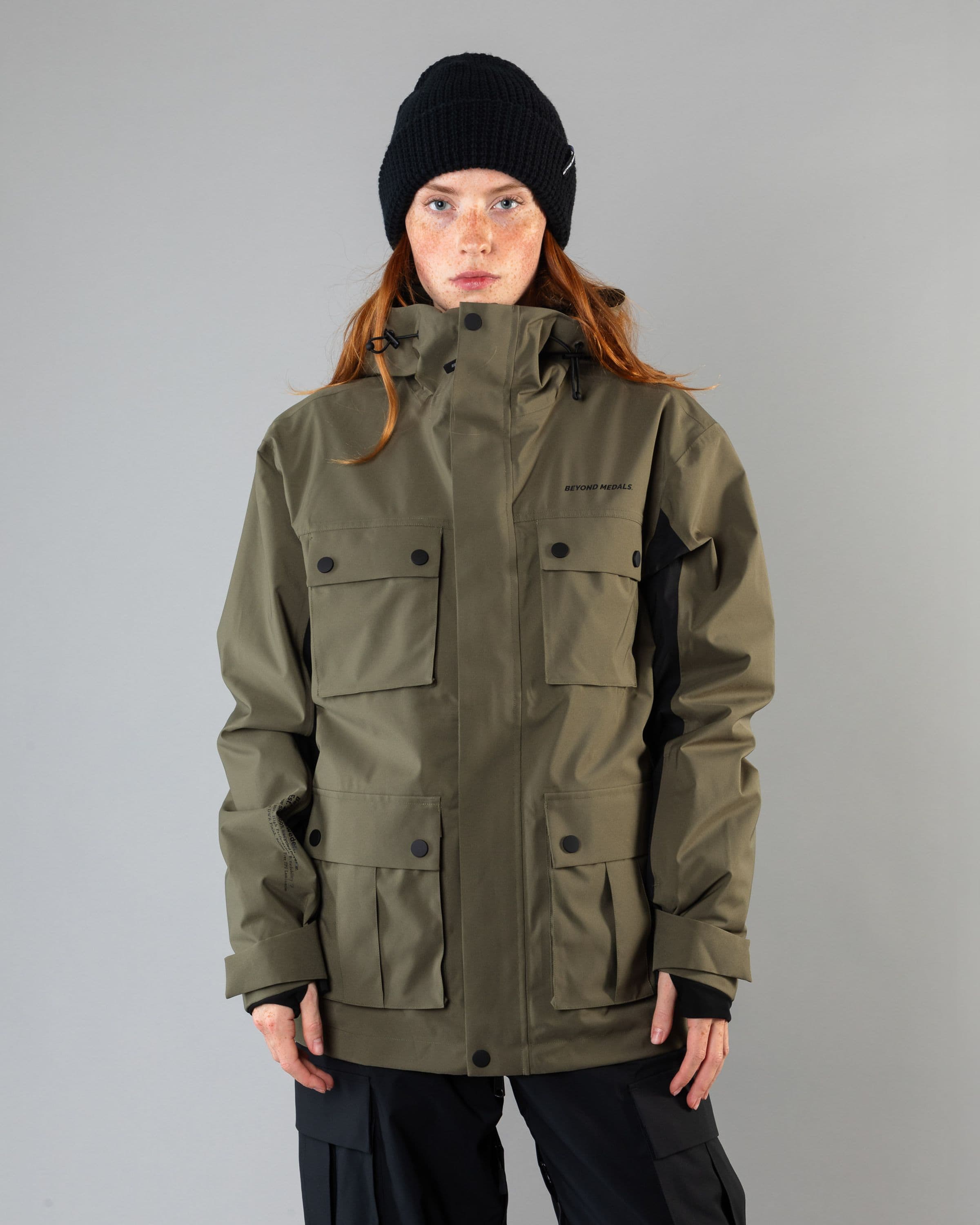Outerwear clothing, cargo jacket 2l in green worn by model, Beyond Medals, 2024, front