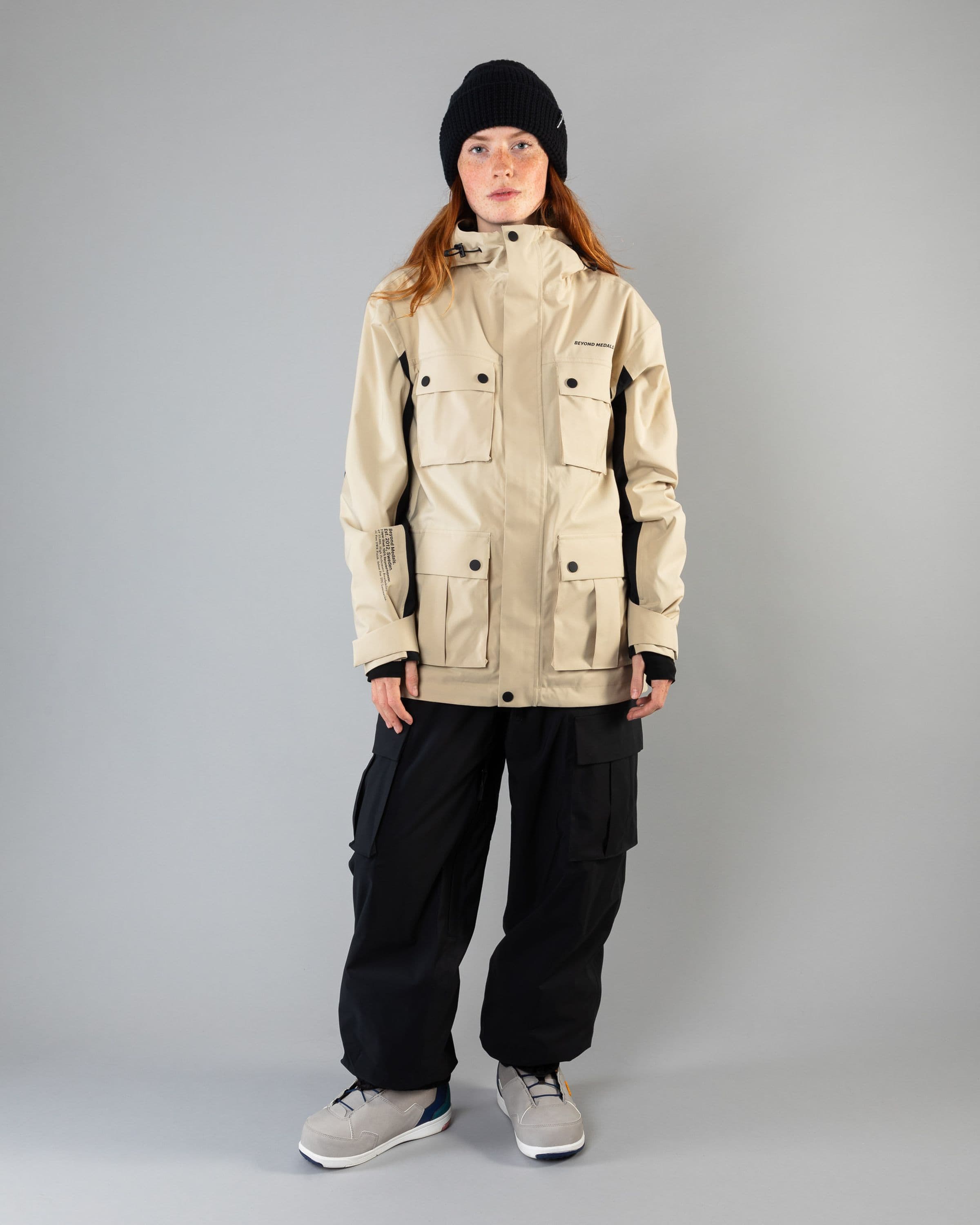 Outerwear clothing, cargo jacket 2l in beige worn by model, Beyond Medals, 2024, full front