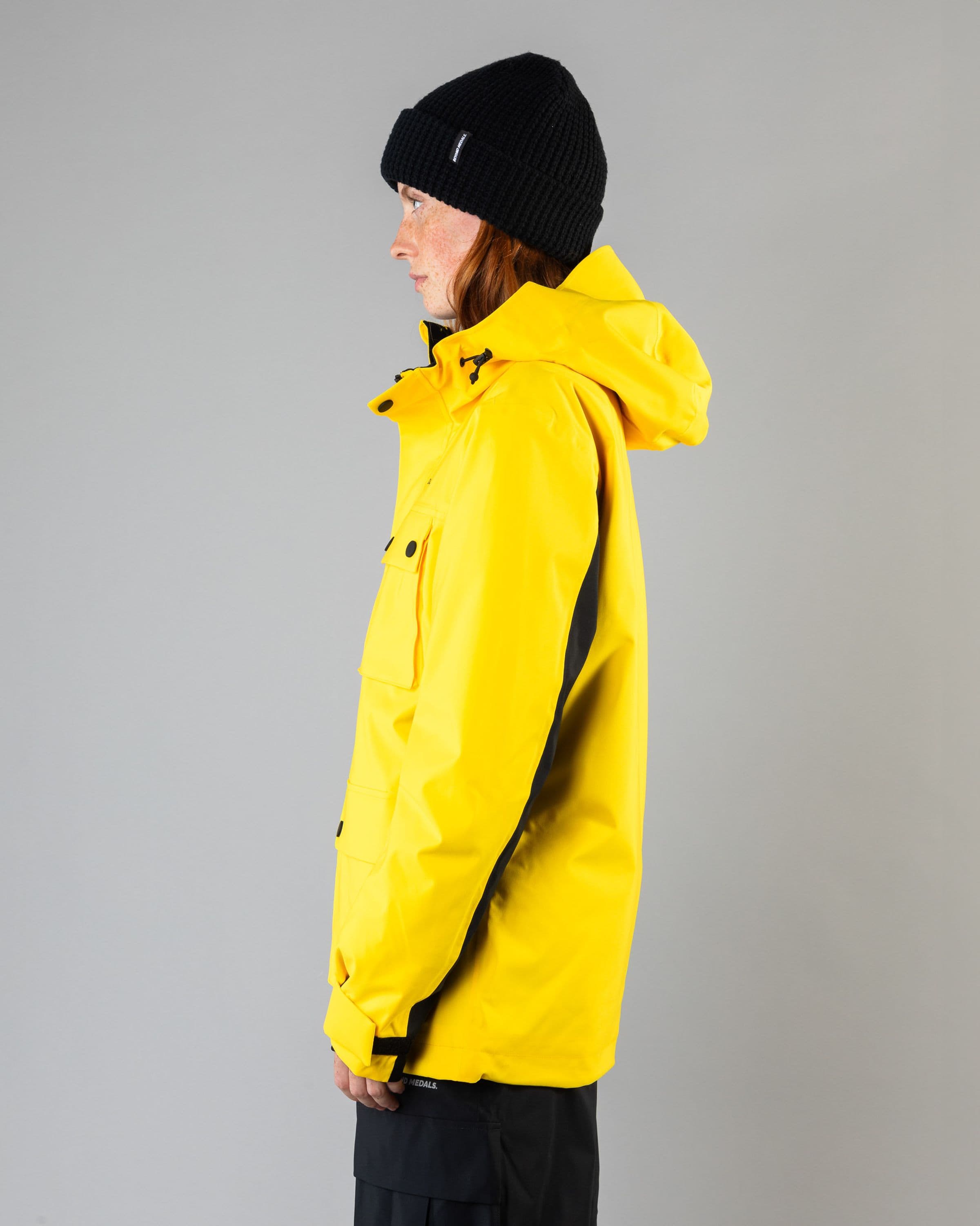 Outerwear clothing, cargo jacket 2l in yellow worn by model, Beyond Medals, 2024, side
