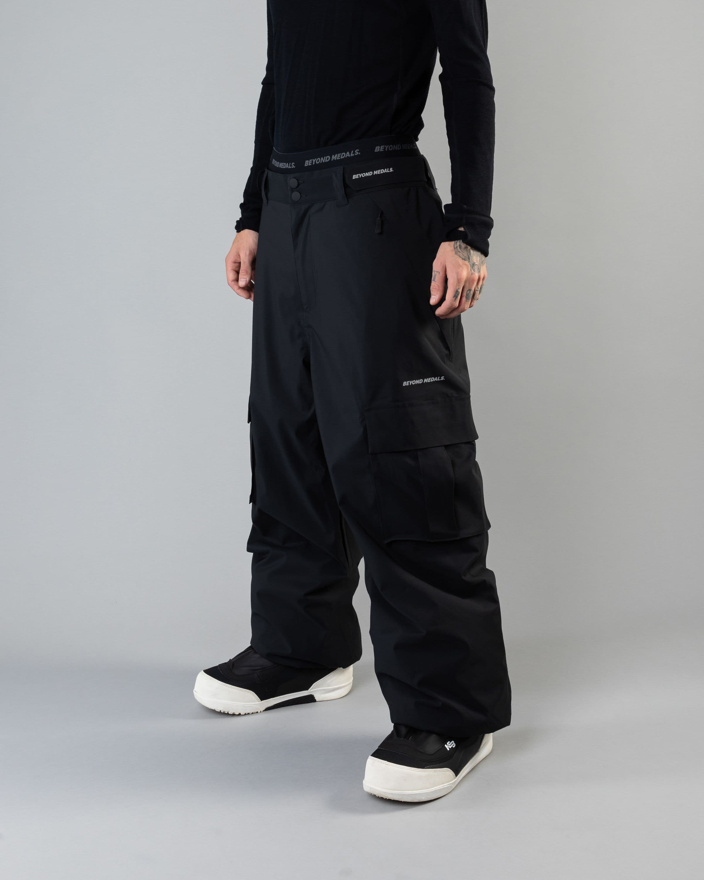 Outerwear clothing, cargo pants in black worn by KEVIN BÄCKSTRÖM, Beyond Medals, 2024, front