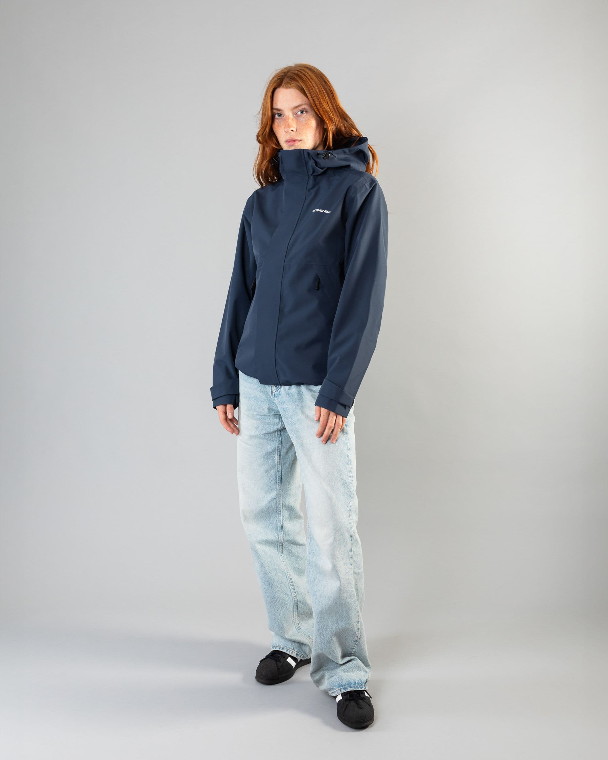 Outerwear clothing, the jacket in blue worn by model, Beyond Medals, 2024, full front street