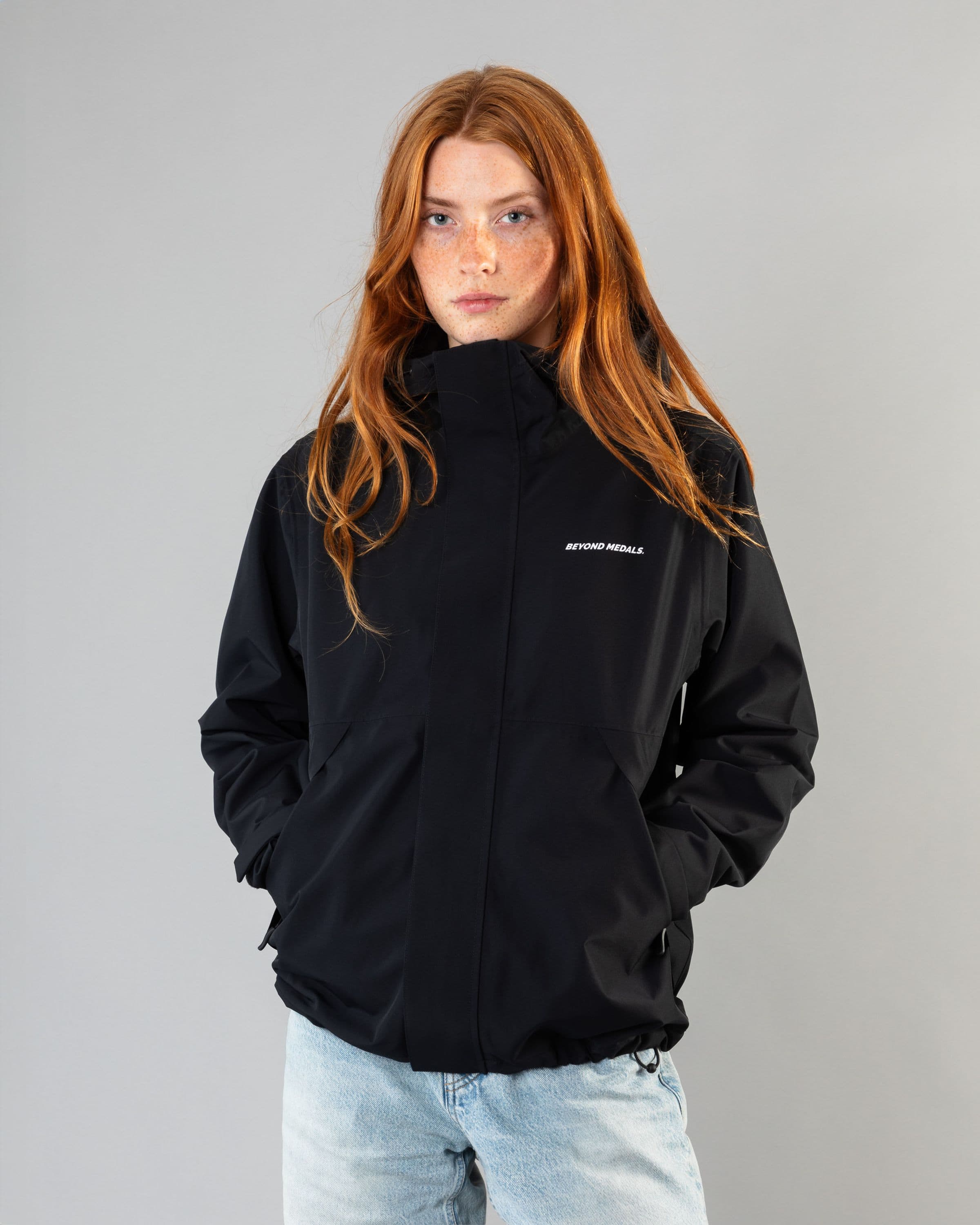 Outerwear clothing, the jacket in black worn by model, Beyond Medals, 2024, front street1