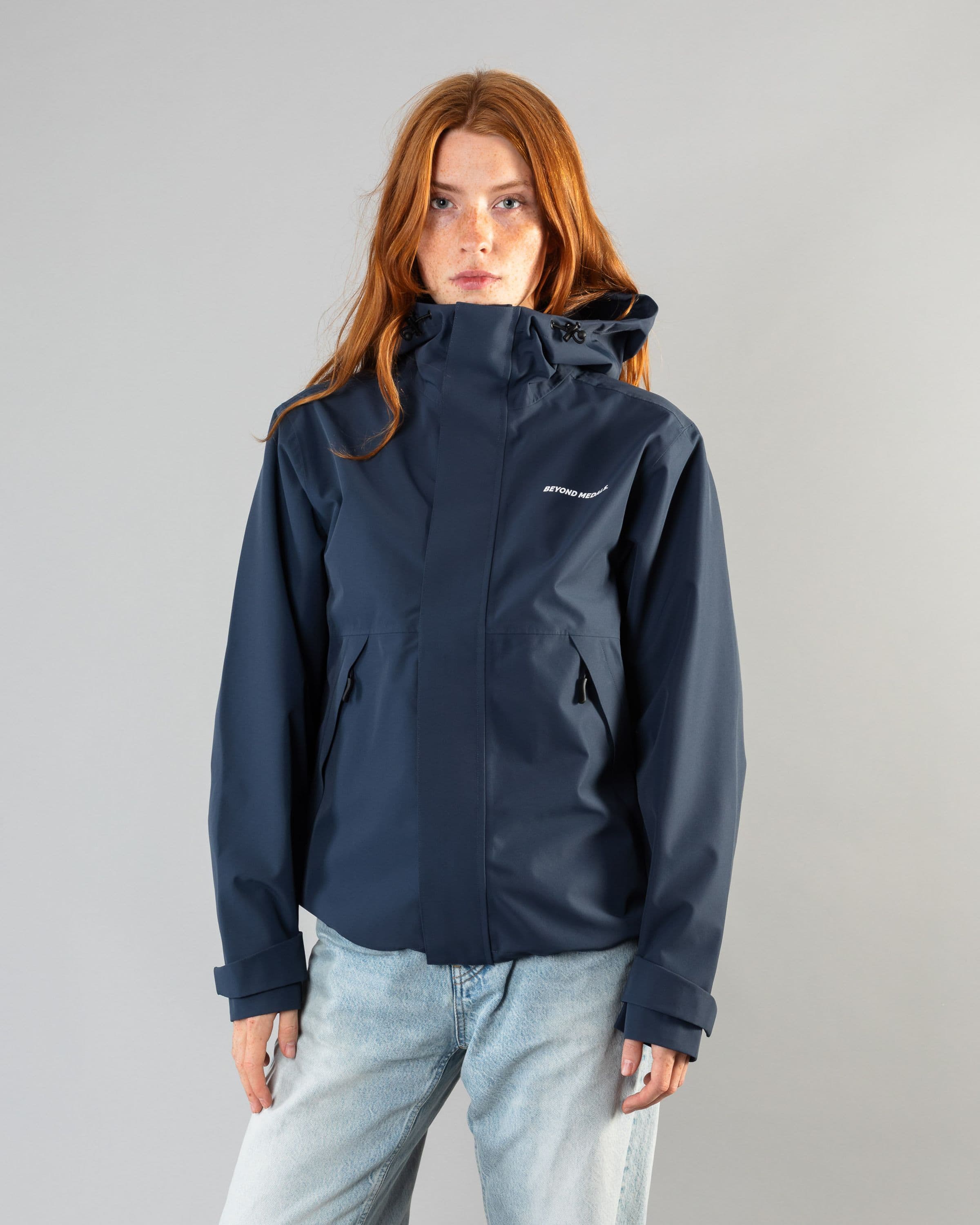 Outerwear clothing, the jacket in blue worn by model, Beyond Medals, 2024, front street