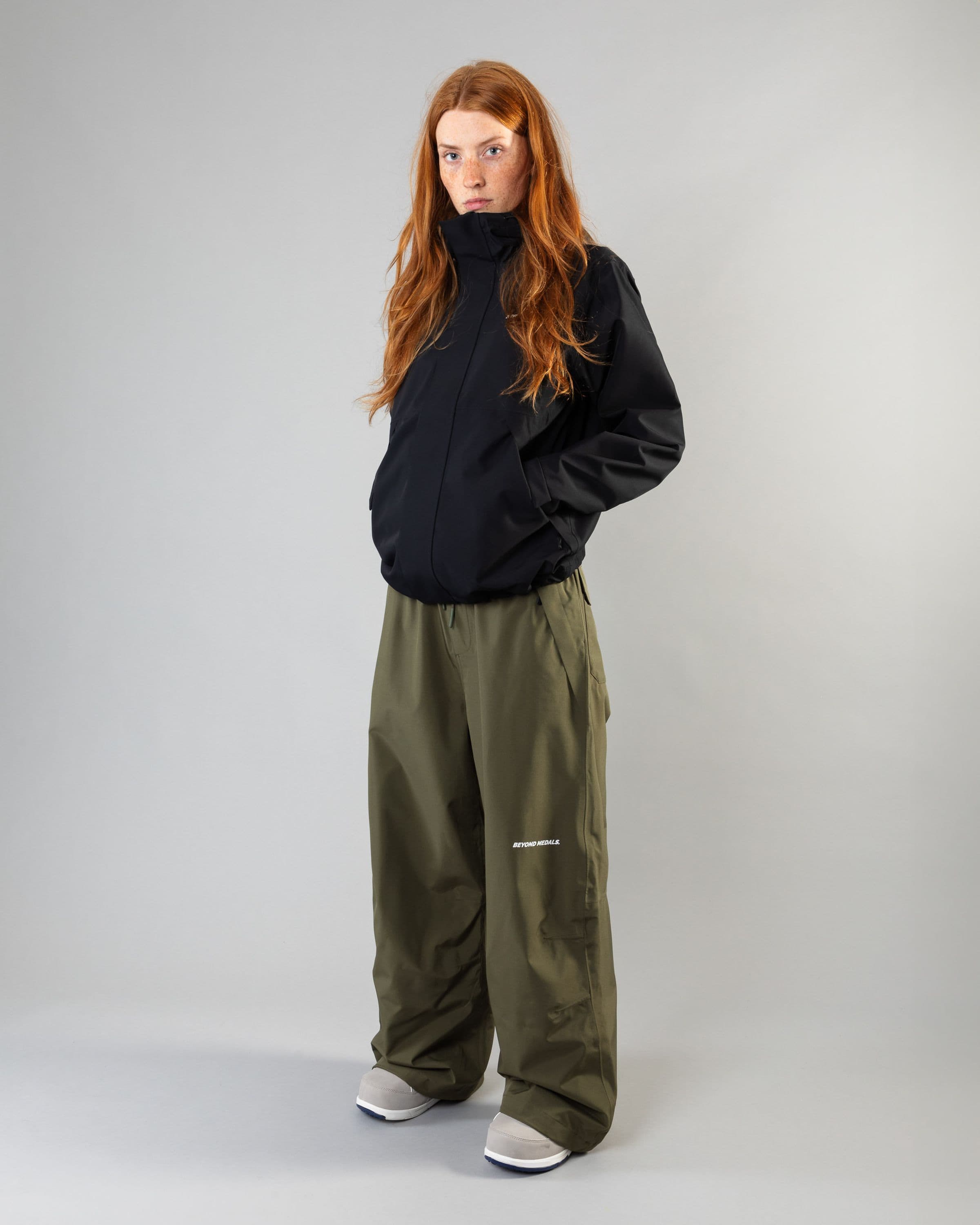 Outerwear clothing, park pants in green worn by model, Beyond Medals, 2024, full front1