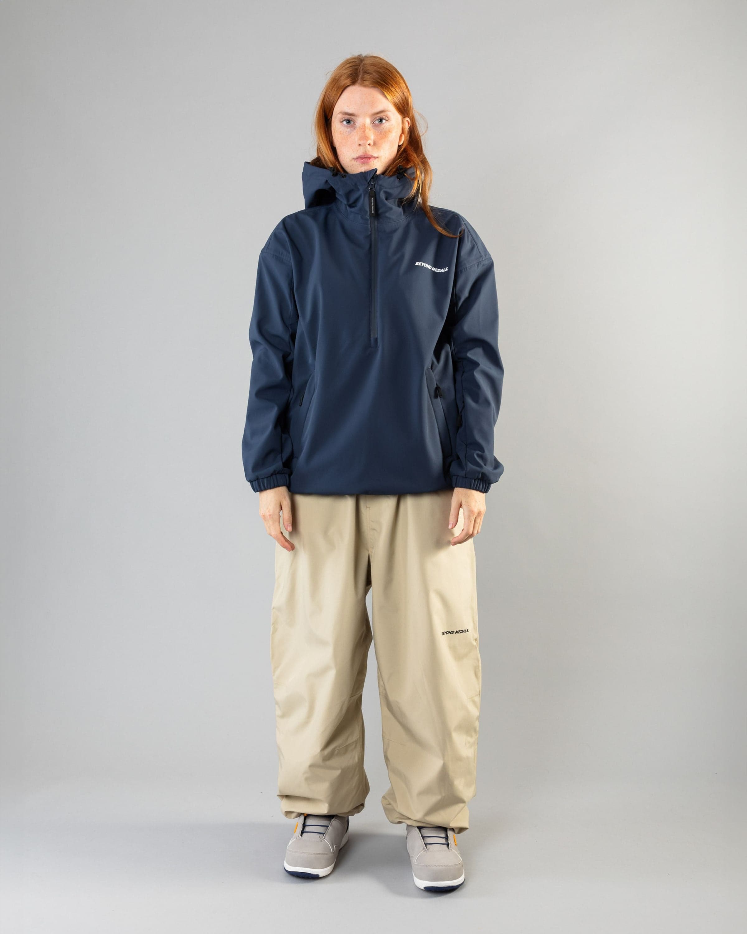 Outerwear clothing, softshell halfzip in blue worn by model, Beyond Medals, 2024, full front