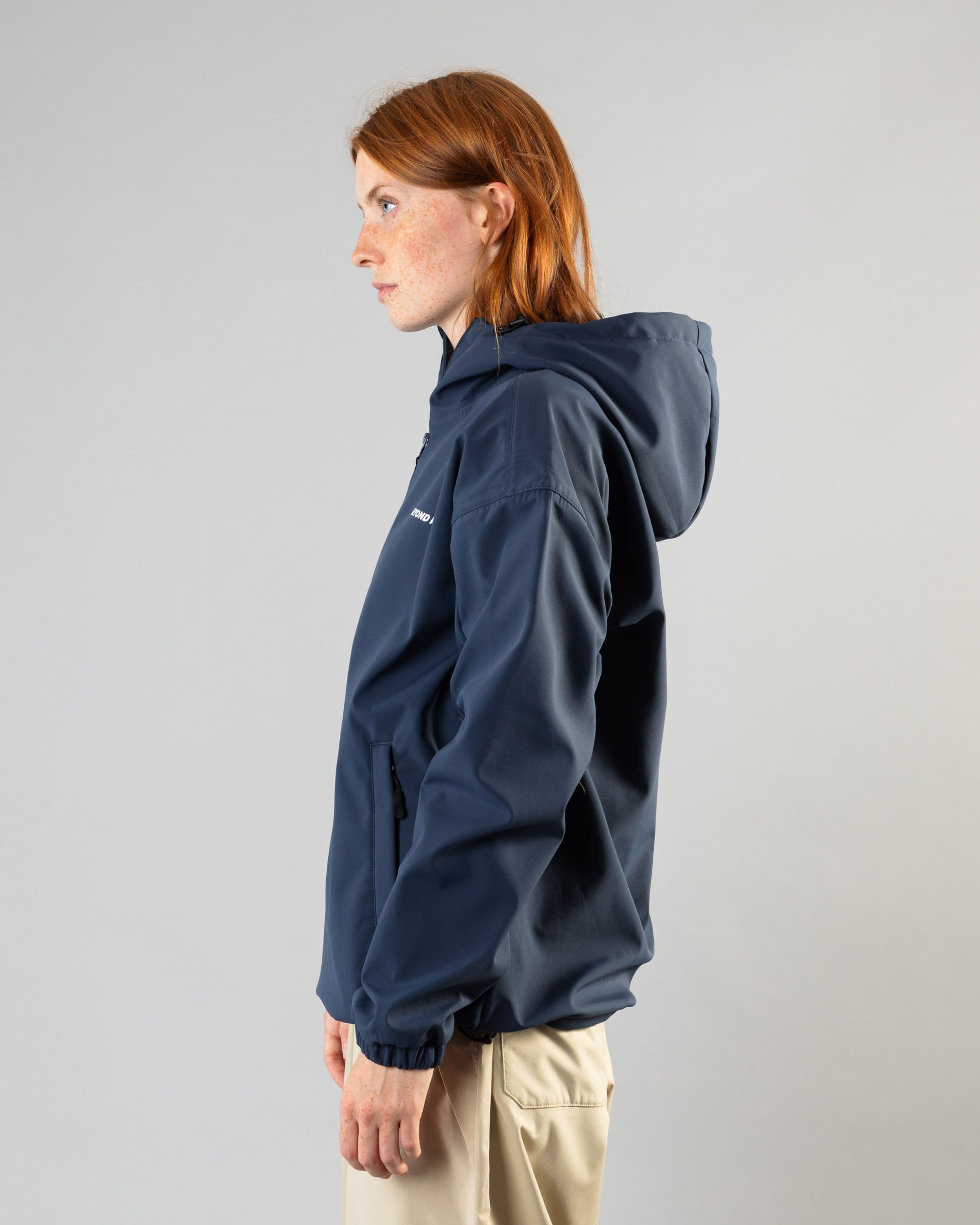Outerwear clothing, softshell halfzip in blue worn by model, Beyond Medals, 2024, side